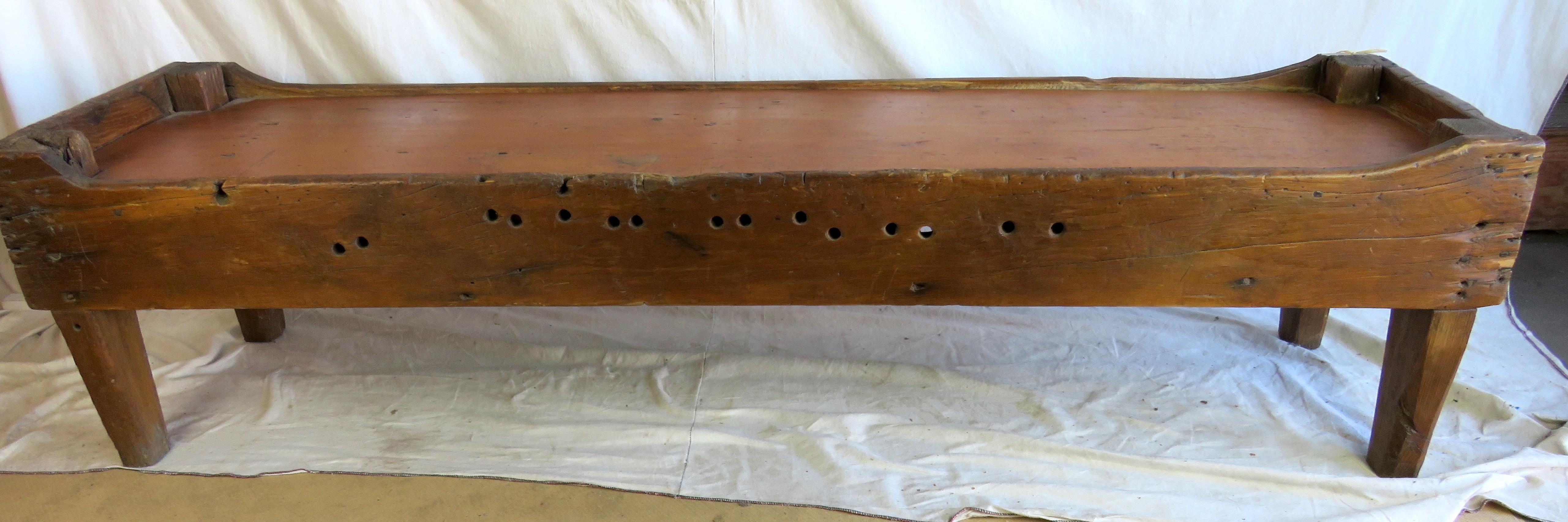 19th century flop bed/bench crafted from pine. Solid construction, good patina.