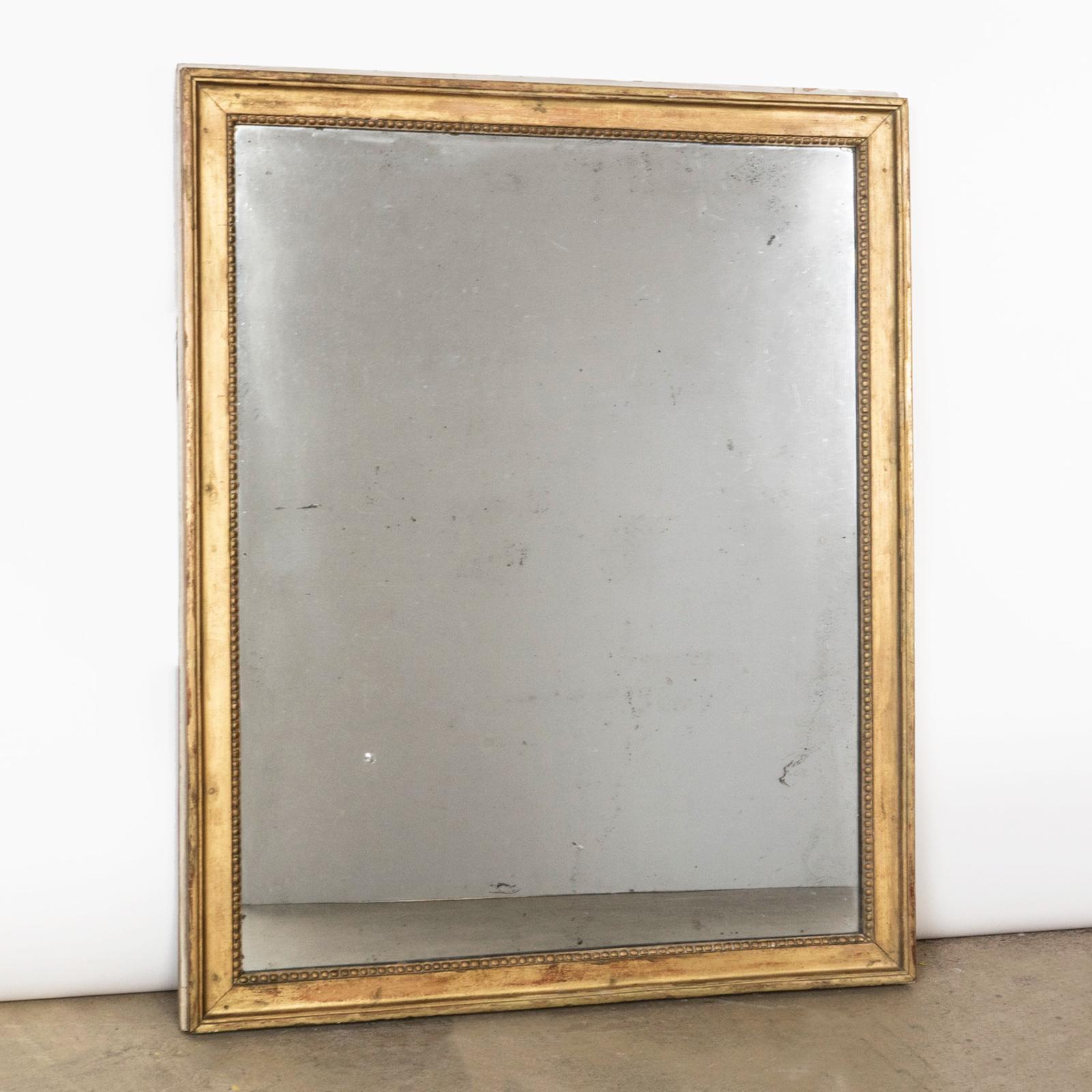 Wonderful French 19th century gilded rectangular mirror.

Beautiful antique rectangular mirror from France. The mirror has a wooden frame, decorated with gesso and gilded with gold leaf. A delicate pearl beading surrounds the glass.

The mirror