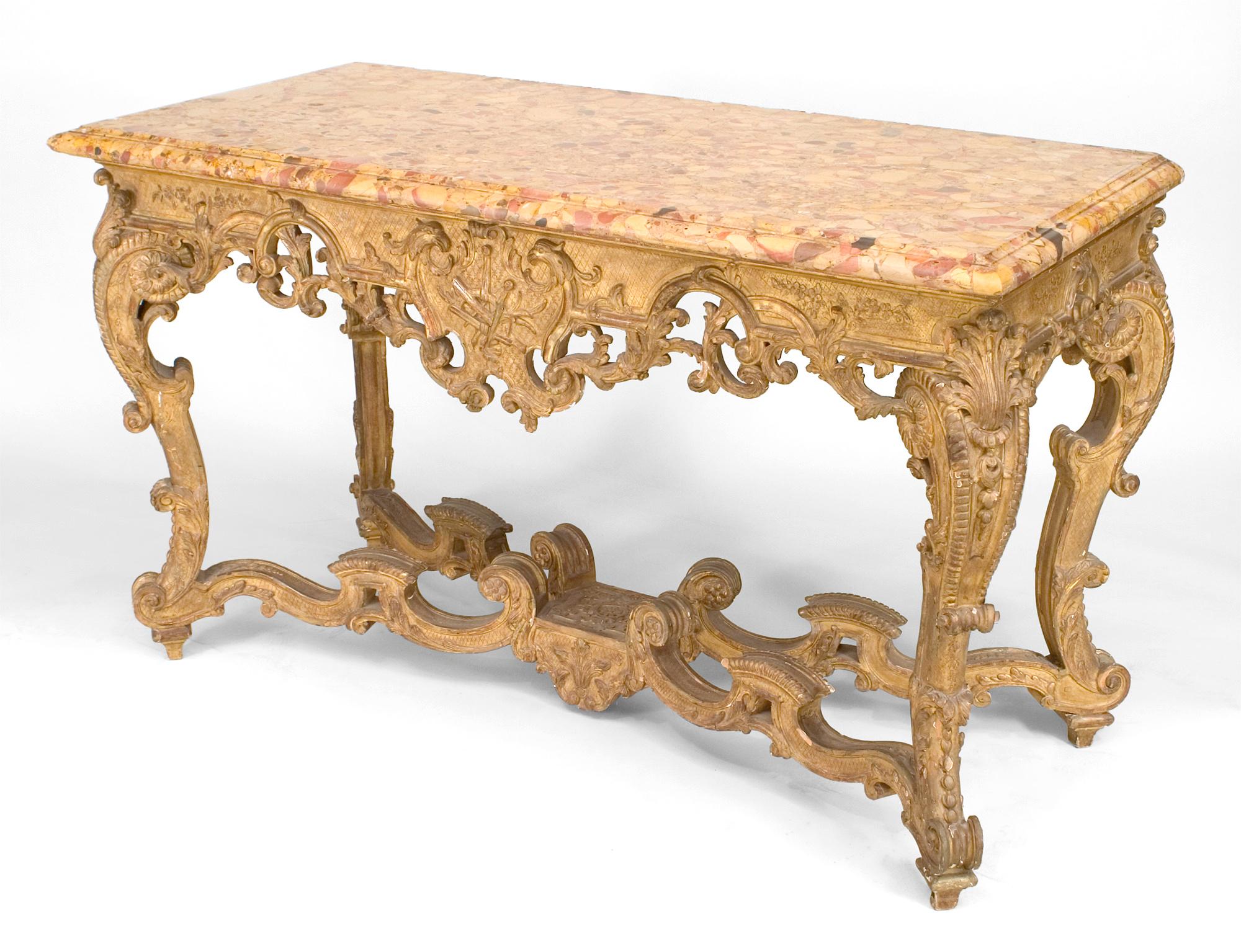 Continental (Possibly German 19th Century) gilt rectangular console table with a carved and filigree apron and stretcher connected with 4 scrolls & breche stepped up marble top.
