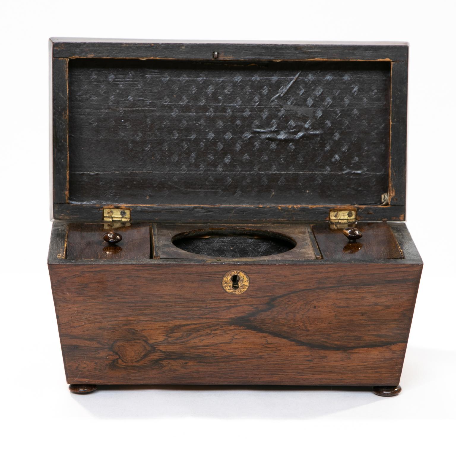 19th century Regency rosewood sarcophagus tea caddy

A tea caddy made of rosewood and in the sarcophagus shape. Fitted with two tea compartments and coverings but missing the waste bowel. Resting on small bun feet. 


            