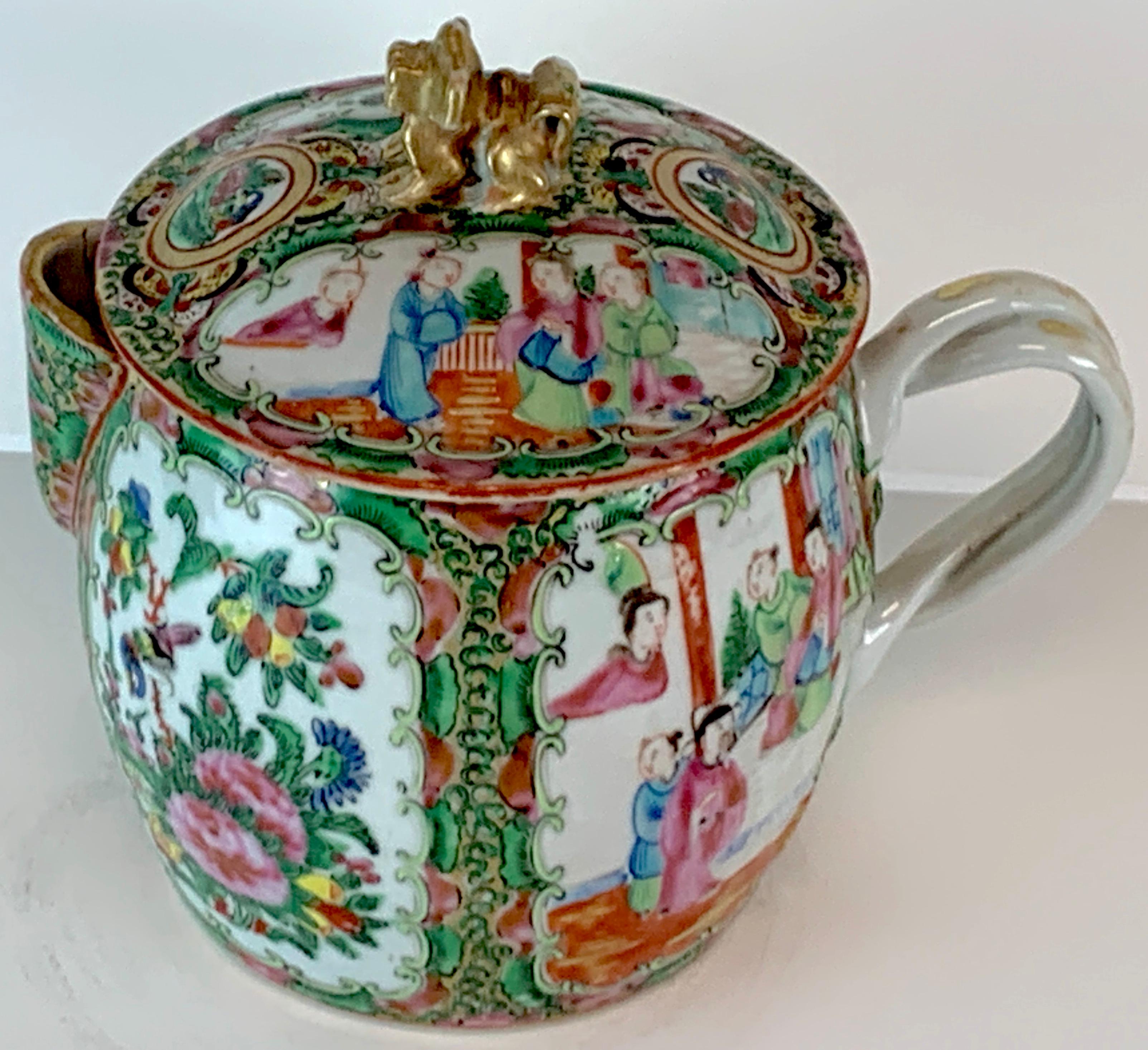 19th century rose medallion cider pitcher with foo dog finial, Nicely decorated in a diminutive size, twisted gilt handles, complete with original cover. Good color. No chips, cracks or repairs.
  