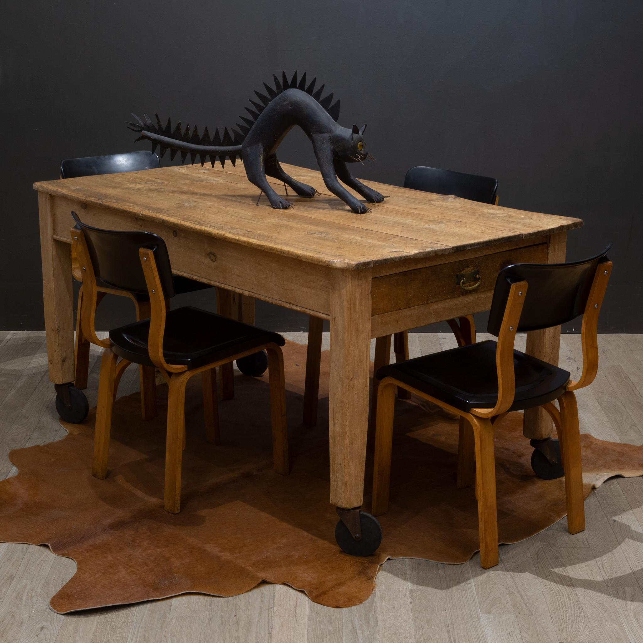 About

A primitive rustic farmhouse dining table table with large hard rubber casters, one side drawer and brass pull. The top consists of wide planks of wood which indicates the age of the piece. The table is very sturdy. 

 CREATOR Unknown.
