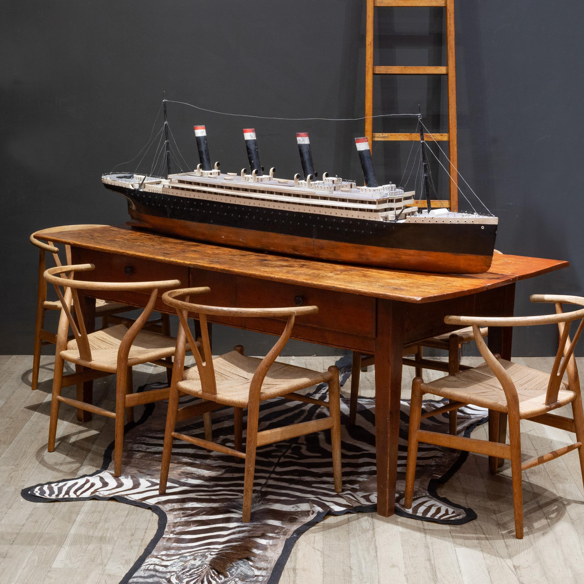 ABOUT

A rustic rustic farmhouse table. Two large front drawers with ample storage. Pegged construction visible on the top and on all four tapered legs. The top consists of two wide planks of wood and a smaller plank in the middle. 

Could be used