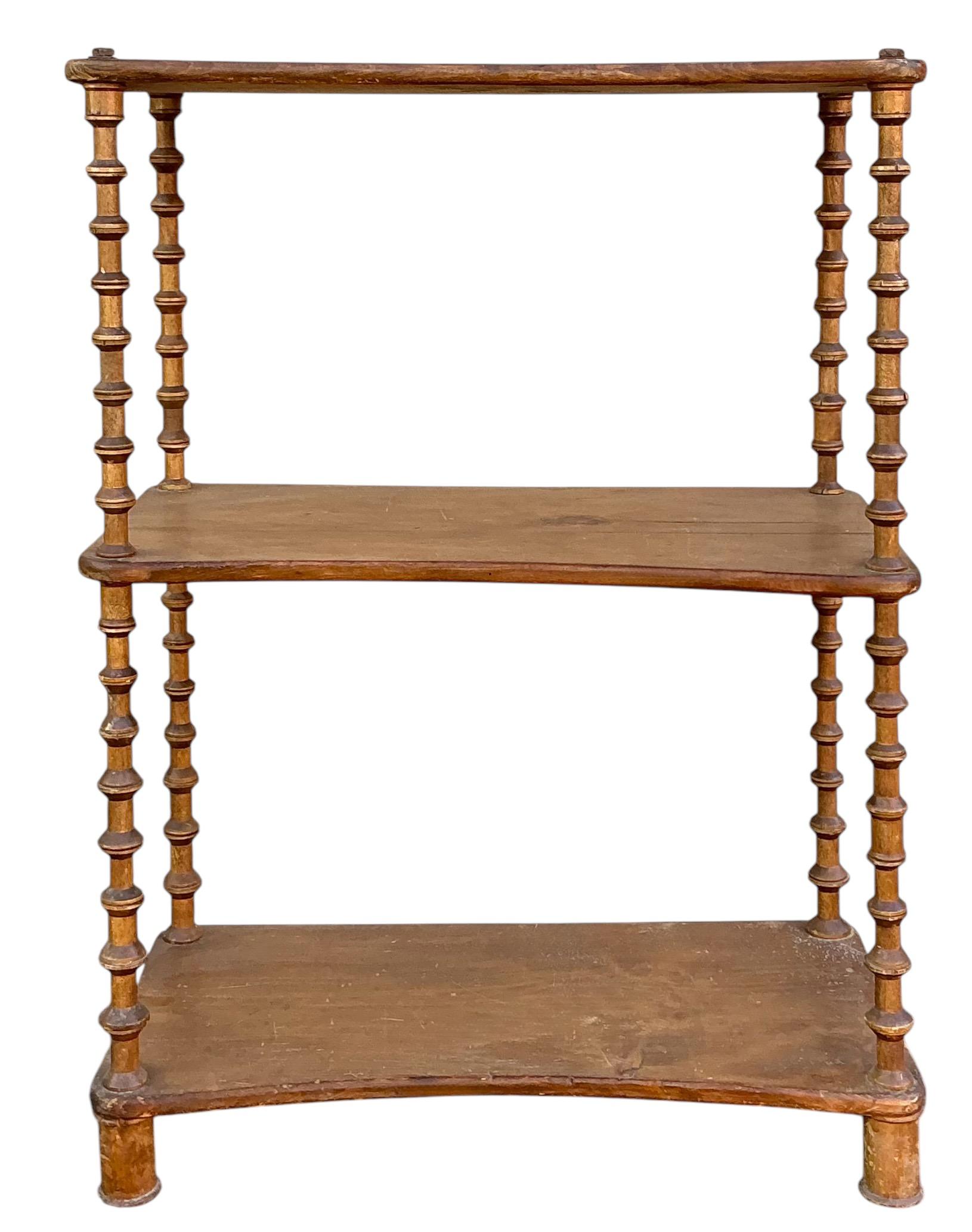 This is a late 19th century carved fruitwood spool or bobbin shelf / etagere. It is 17” to the first tier. It has age appropriate wear. 

This should be eligible for FedEx Freight for quick delivery. 