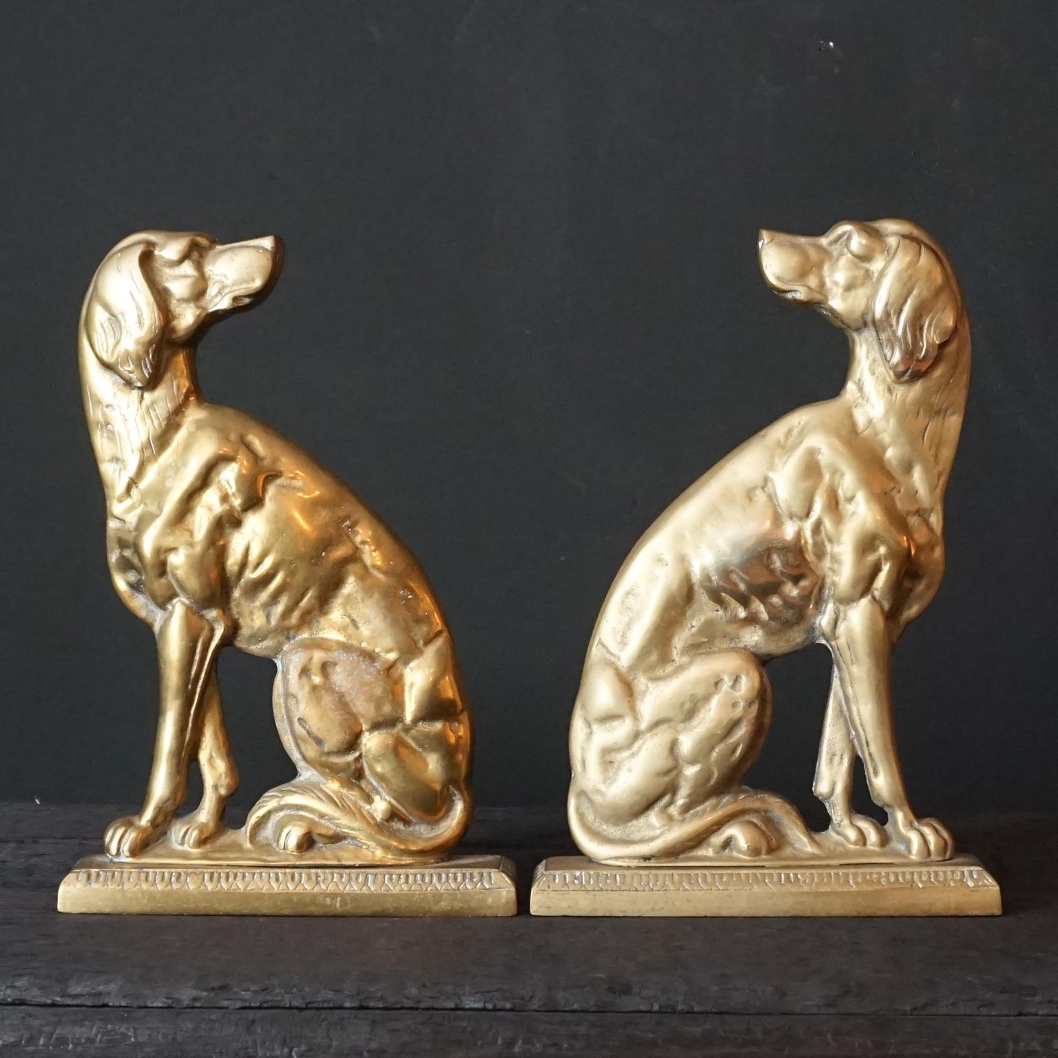A wonderful set of two Victorian heavy cast brass sitting English Pointer dogs. 
Depicted 'en profile' facing towards or from each other. 
They were originally made as doorstoppers, but also very useful as large bookends.
Back to back they make a