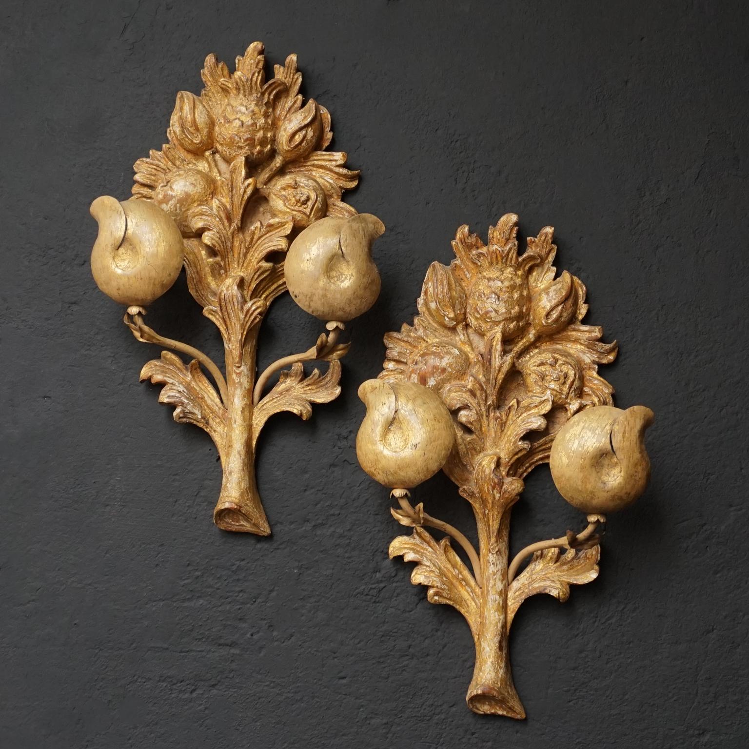Antique Italian carved gilt wood and gessoed wall sconces or appliques shaped like bouquets with foliage, tulips, thistle, apple and Pomegranate decoration, 19th century.

Wonderfully Italian carved gessoed and gold leafed appliques, each with two
