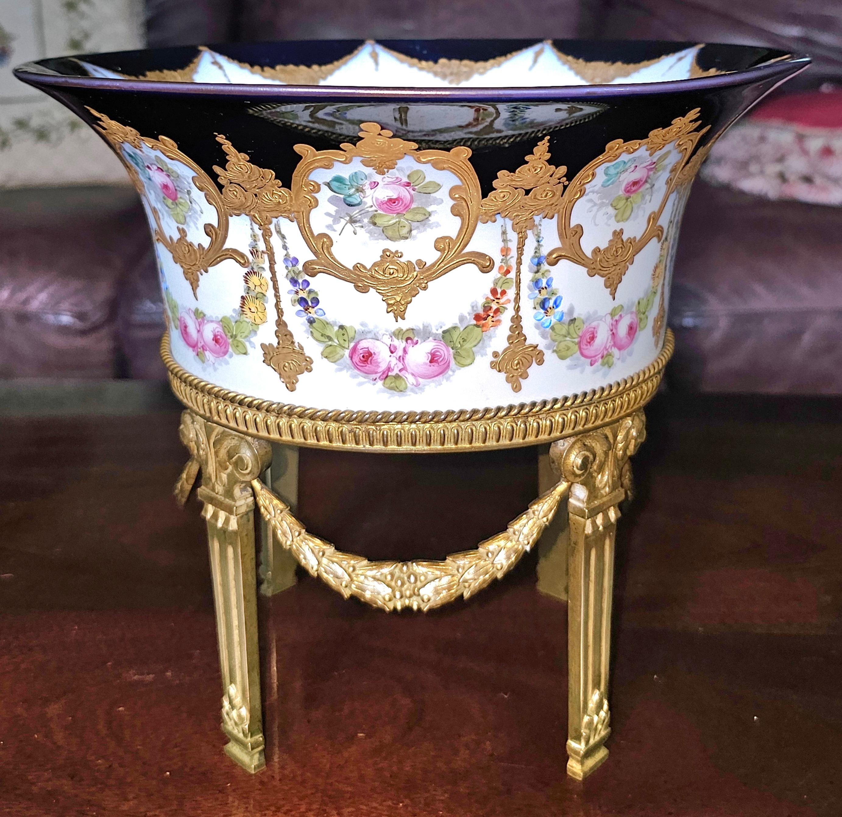 A 19th Century Sevres Porcelain Gilt Bronze Centerpiece Bowl on stand, Signed and Numbered 113 of 327
Measures 10