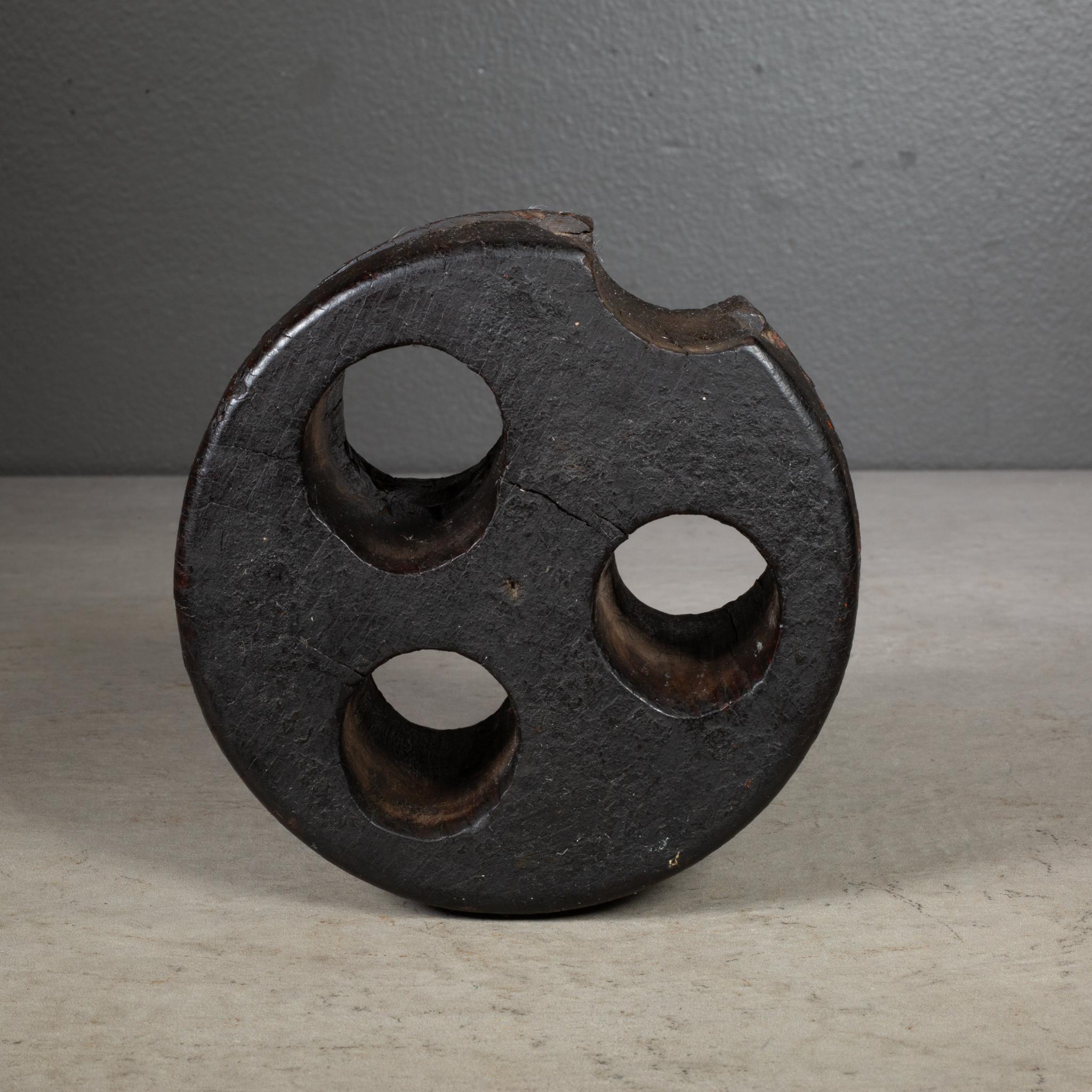ABOUT

An original solid wood ship's deadeye triple hole pulley. 

    CREATOR Unknown. 
    DATE OF MANUFACTURE c.1800s. 
    MATERIALS AND TECHNIQUES Wood. 
    CONDITION Good. Wear consistent with age and use.
    DIMENSIONS H 4.25 in. Diameter