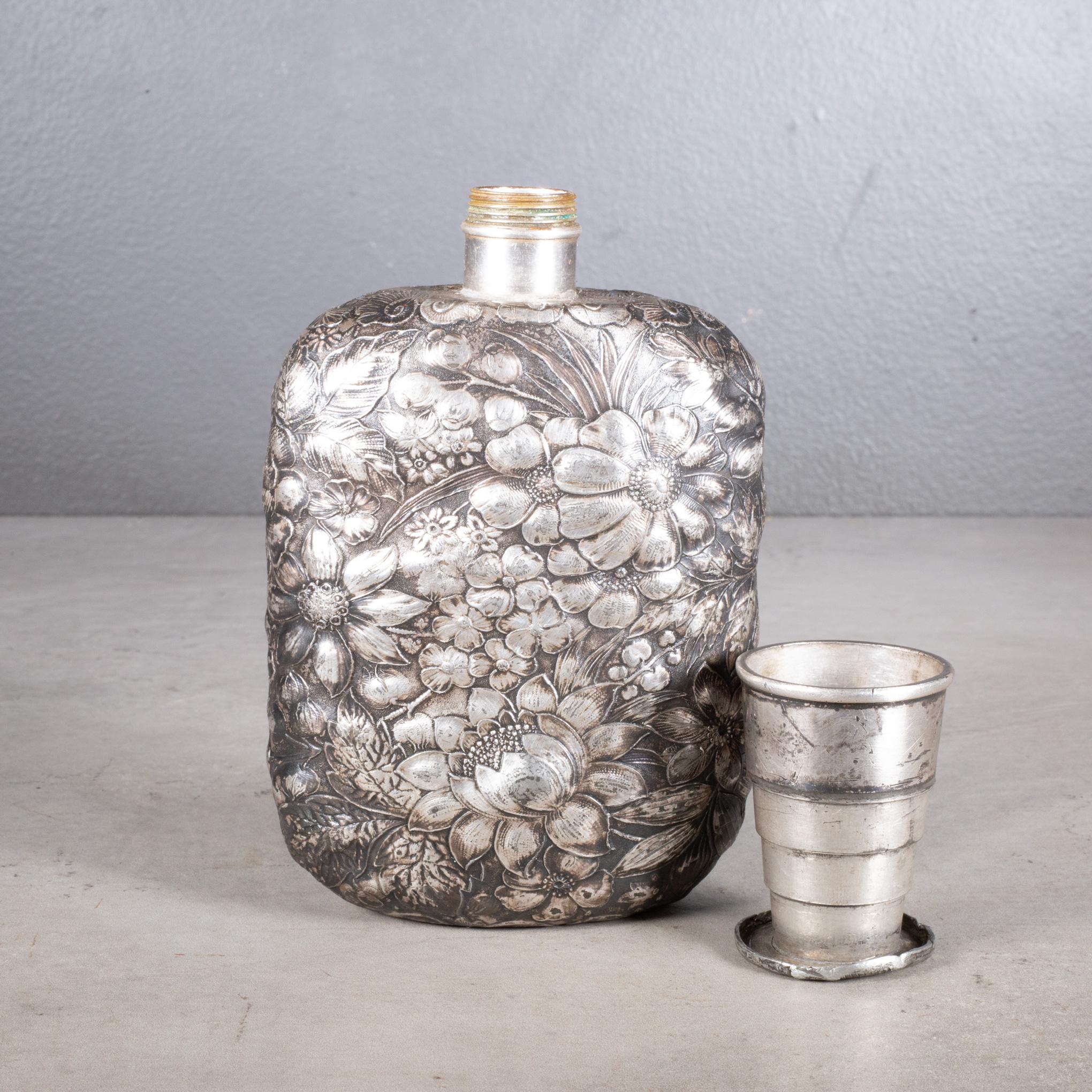 ABOUT

A 19th century silverplate, repousse hip or whiskey flask with expandable lid that untwists into a 2” cup. Stamped with company logo and 
