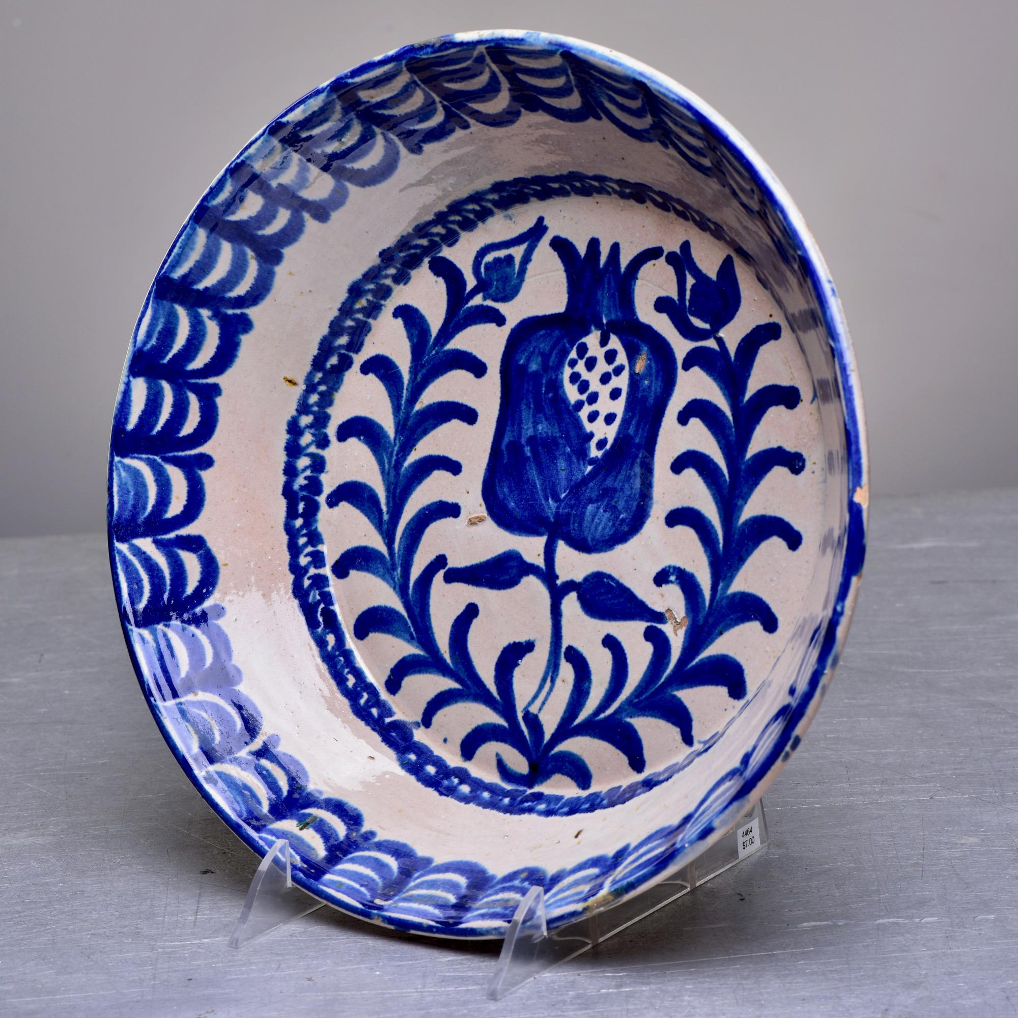 Circa 1890s Spanish Fajalauza terra cotta bowl in traditional blue and white glaze with pomegranate design. Fajalauza pottery is from Granada, Spain and originated during the 13-15th centuries when the Nasrid Muslim dynasty ruled the Iberian