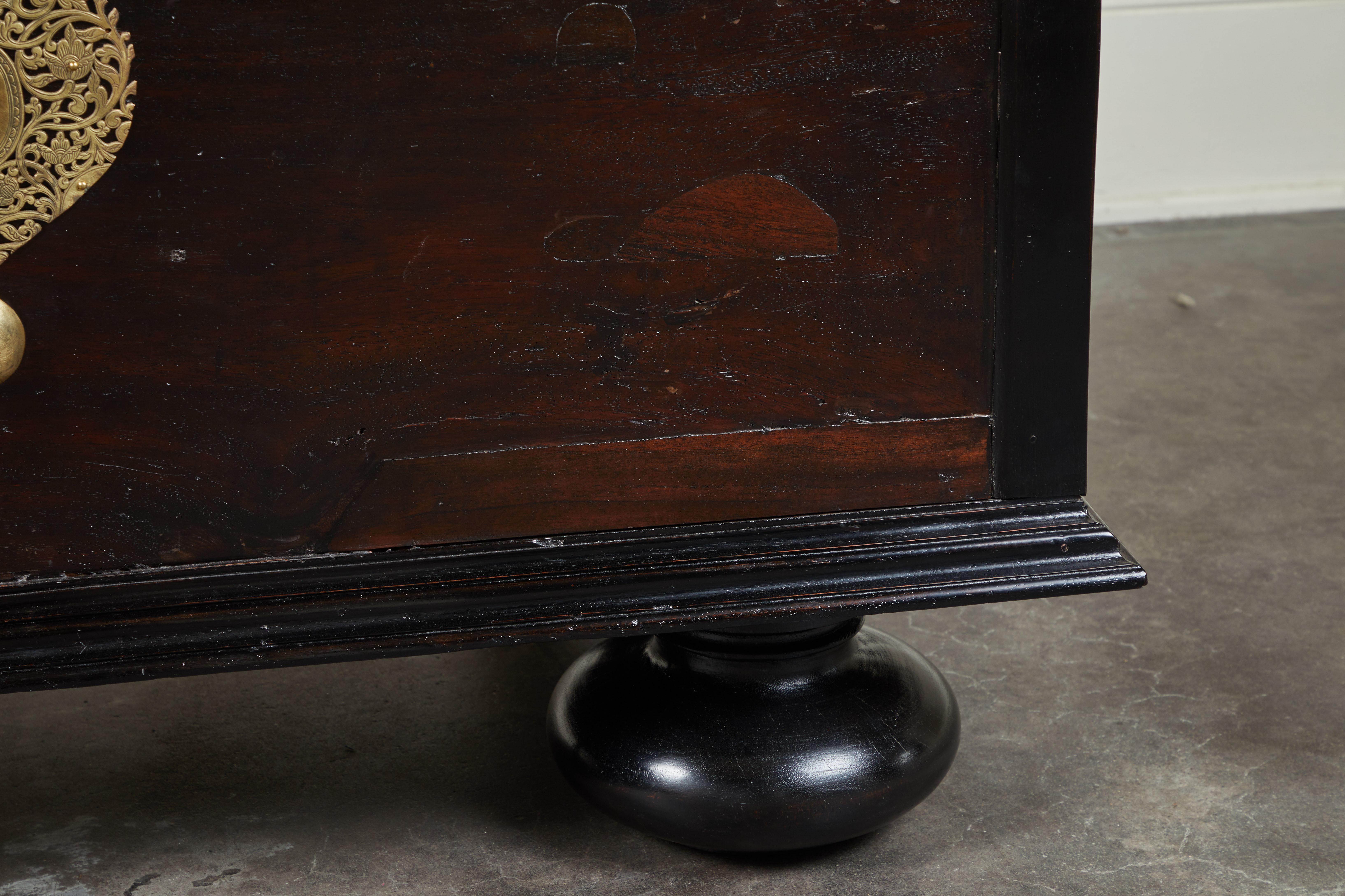 A 19th century Sri Lankan Trunk made of jakwood with ebony trim. Bright hardware and handles on squat feet.