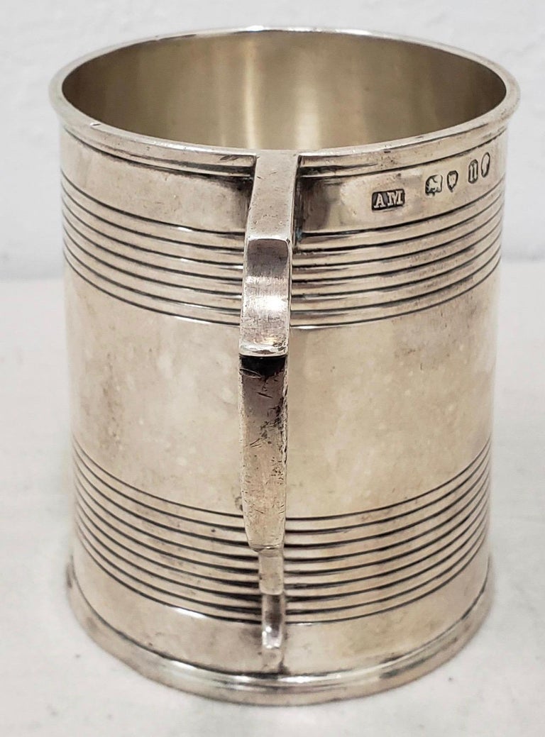 Antique sterling silver christening cup with hallmarks

Fine sterling silver christening tankard with hallmarks.

We are unsure of what the hallmarks represent. If you know, please reach out.

Dimensions 2.75