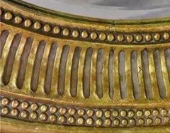 Espejo redondo de madera dorada estilo Regencia Michael Taylor del siglo XIX