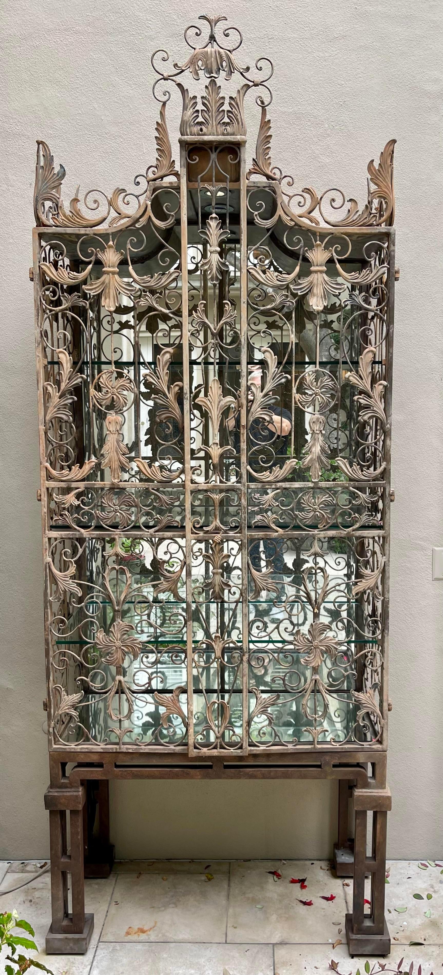 Priced Each. Two available.
19th C Style Wrought Iron Italian Indoor Outdoor Display Cabinet. Featuring thick glass shelves.