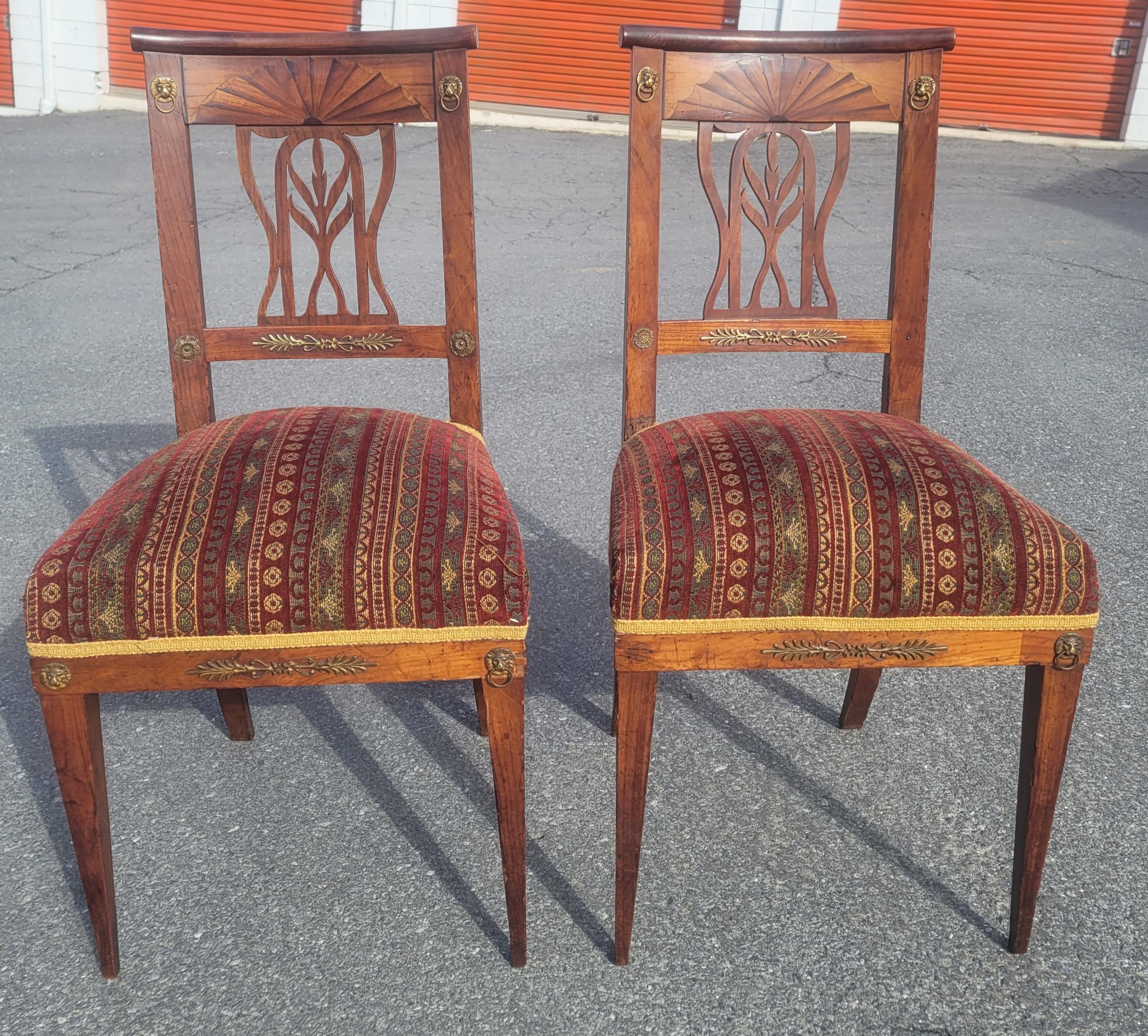 A magnificent pair of 19th century Swedish continental brass mounted and parquetry inlaid cherry chairs. Beaitiful inlay and parquetry work on backs. 
very comfortable, firm seats with springs. Upholstery in very good condition.
Measure 17