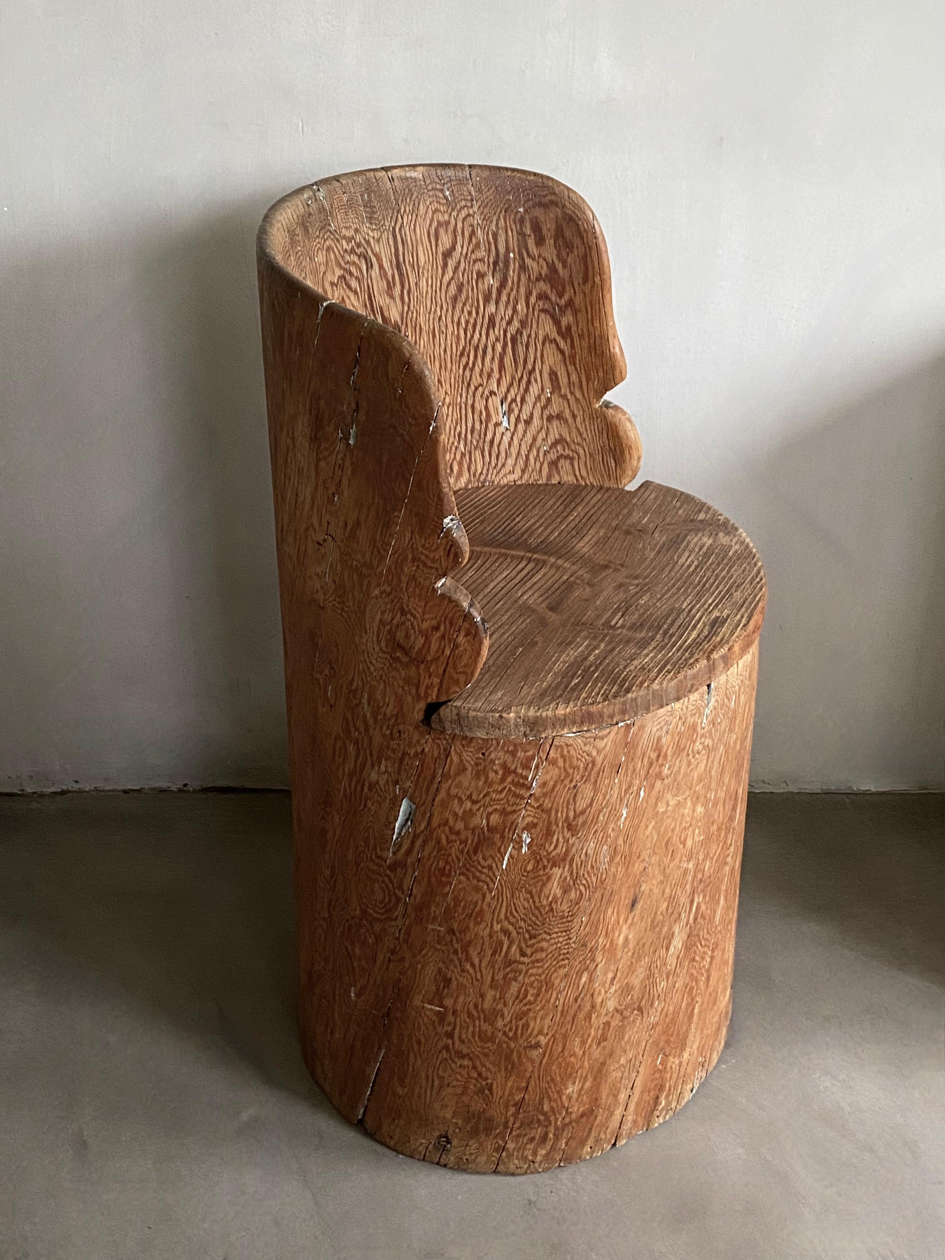 Beautiful Swedish artisan work from the 19th century.
Sculpted in pine wood and full of original patina with a silky feel from years of use.
Hollowed out and polished from a softwood trunk.

This primitive representation of a chair has a lot of