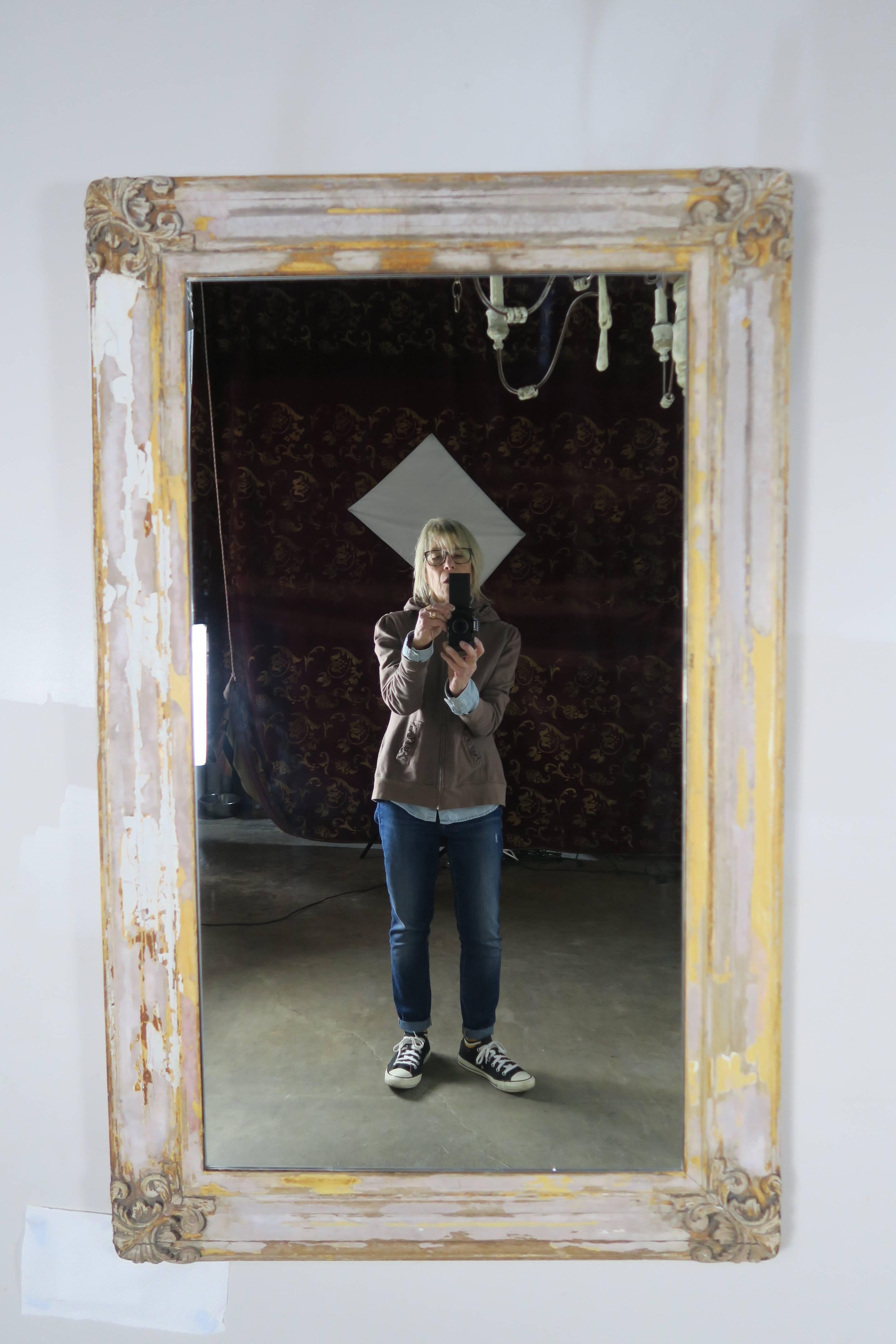 19th century Swedish cream and yellow distressed painted mirror with beautifully carved corners.