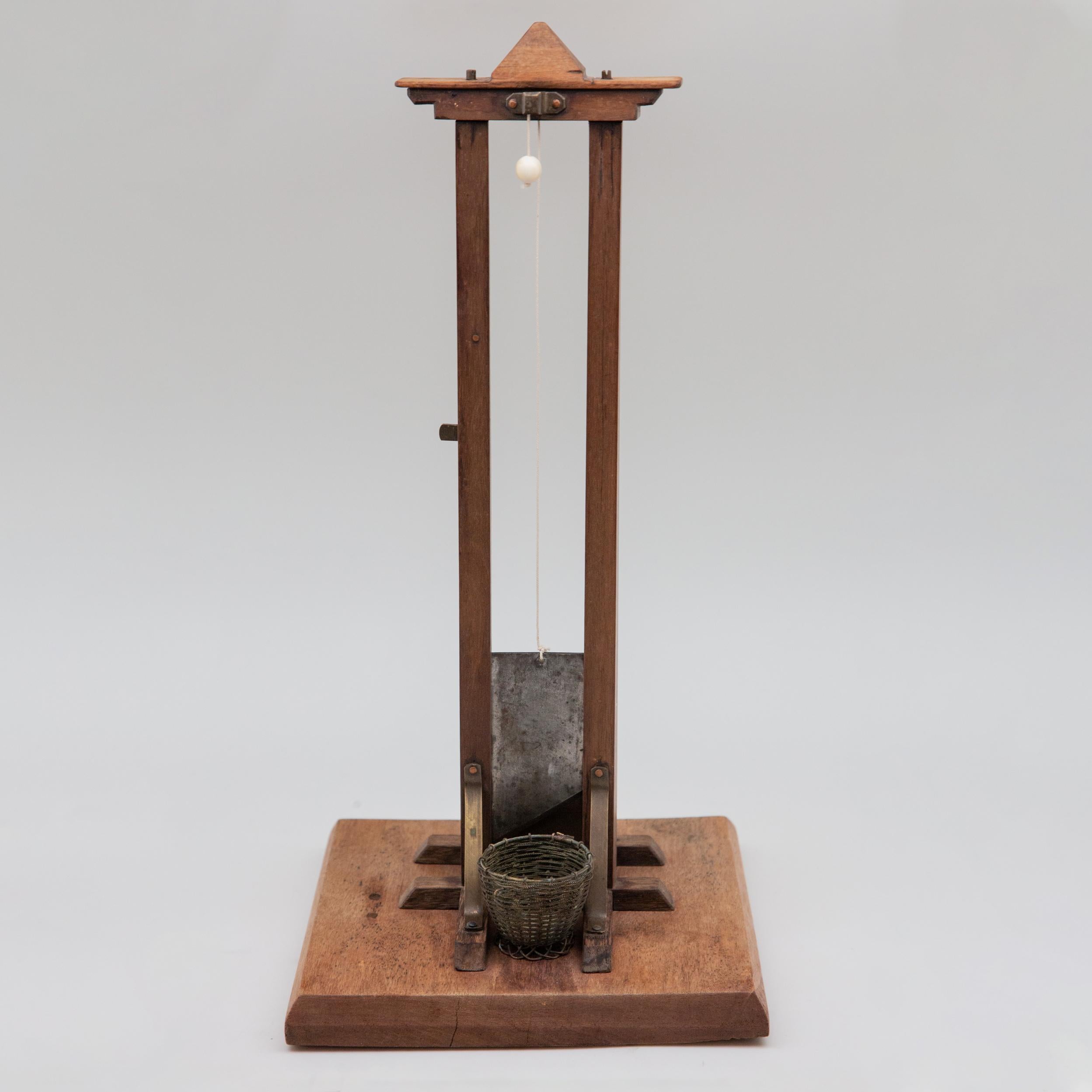 19th century tall miniature Guillotine cigar cutter. Antique miniature Guillotine cigar cutter cigar tip basket, French late 19th-early 20th century. It was in 1789, when the physician Joseph-Ignace Guillotin, recommended the use of this type of