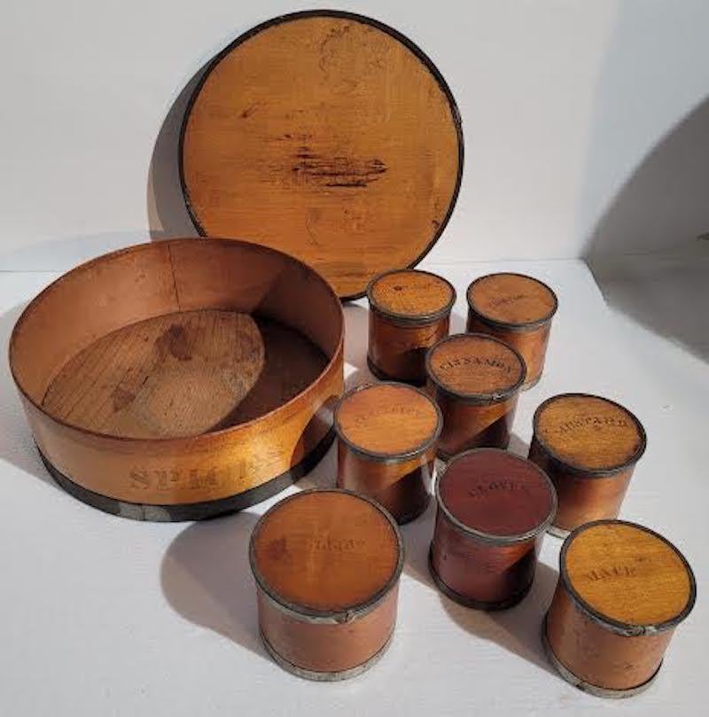 19th C Tin Wrapped Wooden Spice Containers.
Stamped: PATENT PACKAGE CO. NEWARK, NEW JERSEY. PAT'D AUG. 31, 1858. Lightweight hardwood construction. Rare American maker. Great condition for age. Theses Boxes were taken along and used while traveling