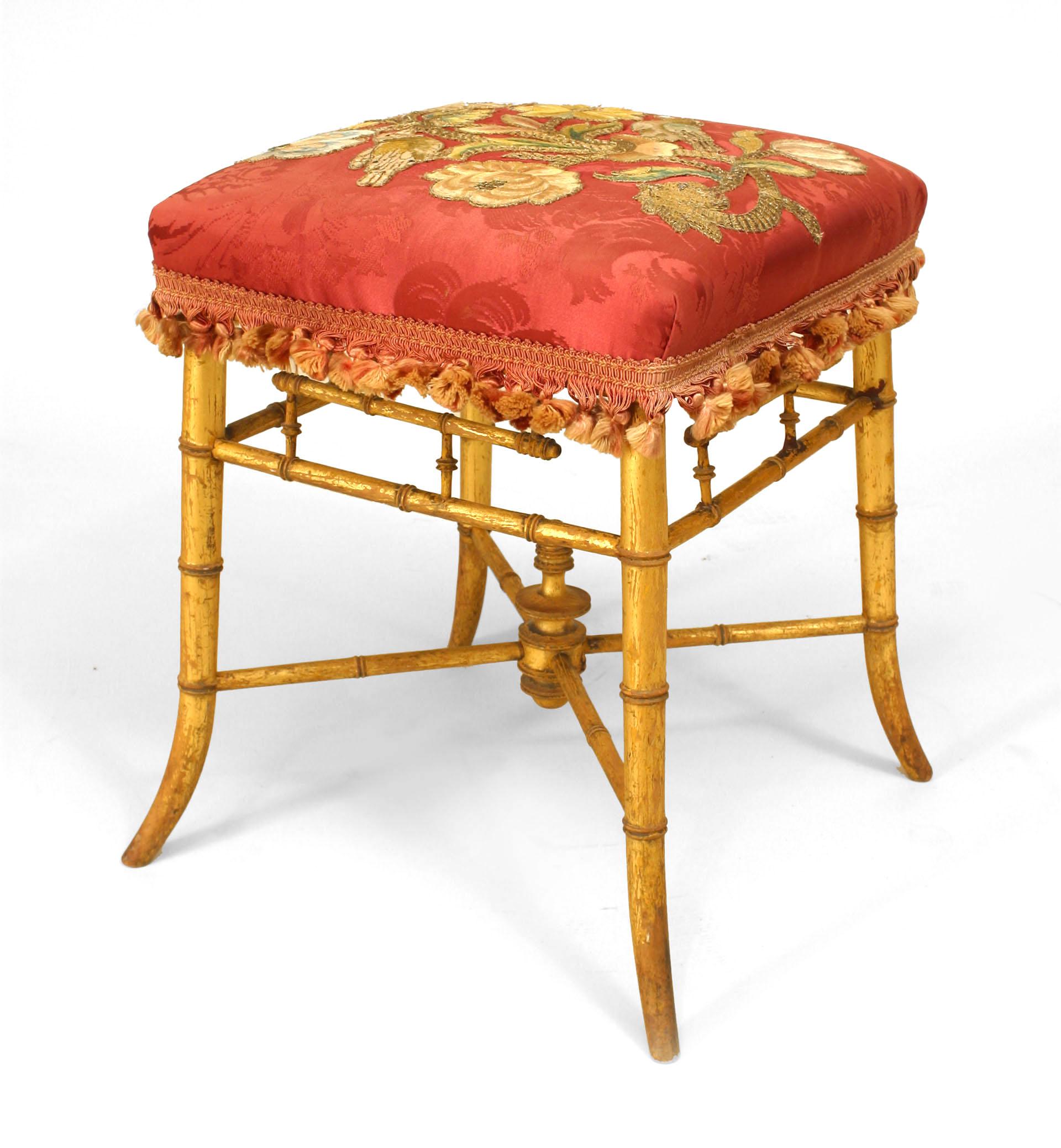 Nineteenth century French faux bamboo gilt square bench with a stretcher and rose damask upholstered seat with applied floral embroidery.