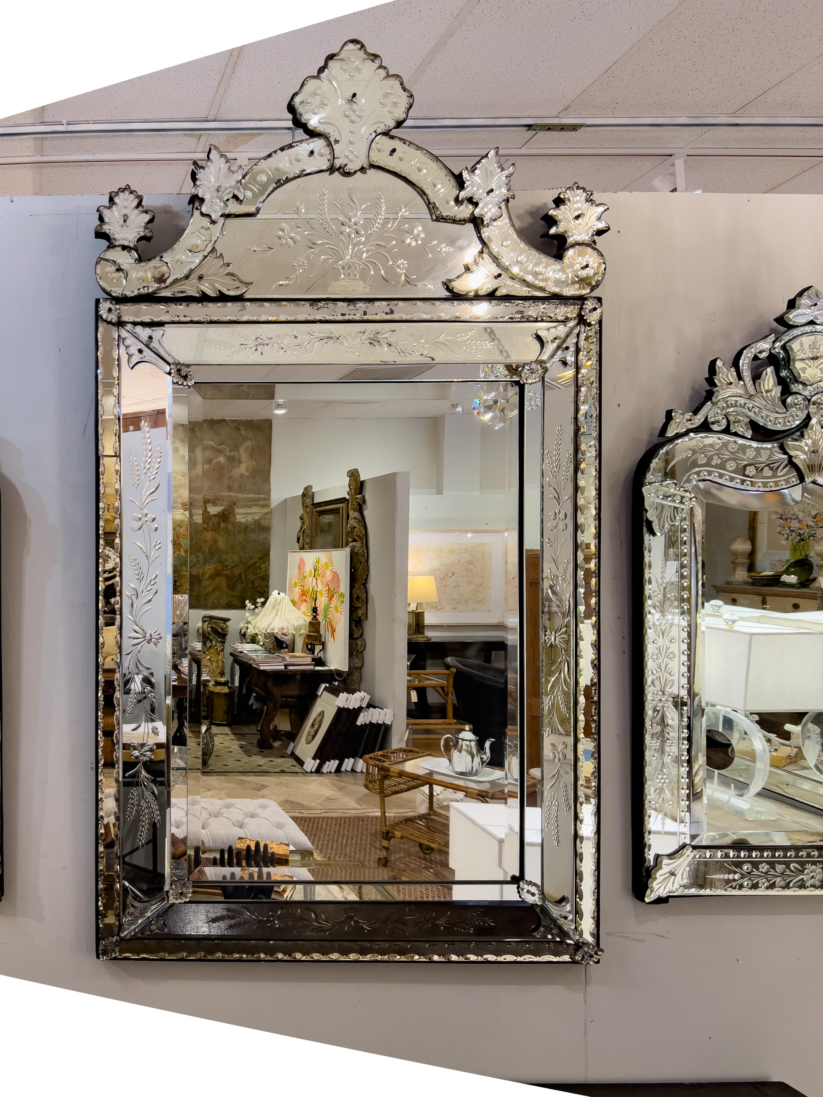 19th c. Venetian rectangular mirror with etched and beveled mirror accents and a shaped cartouche.