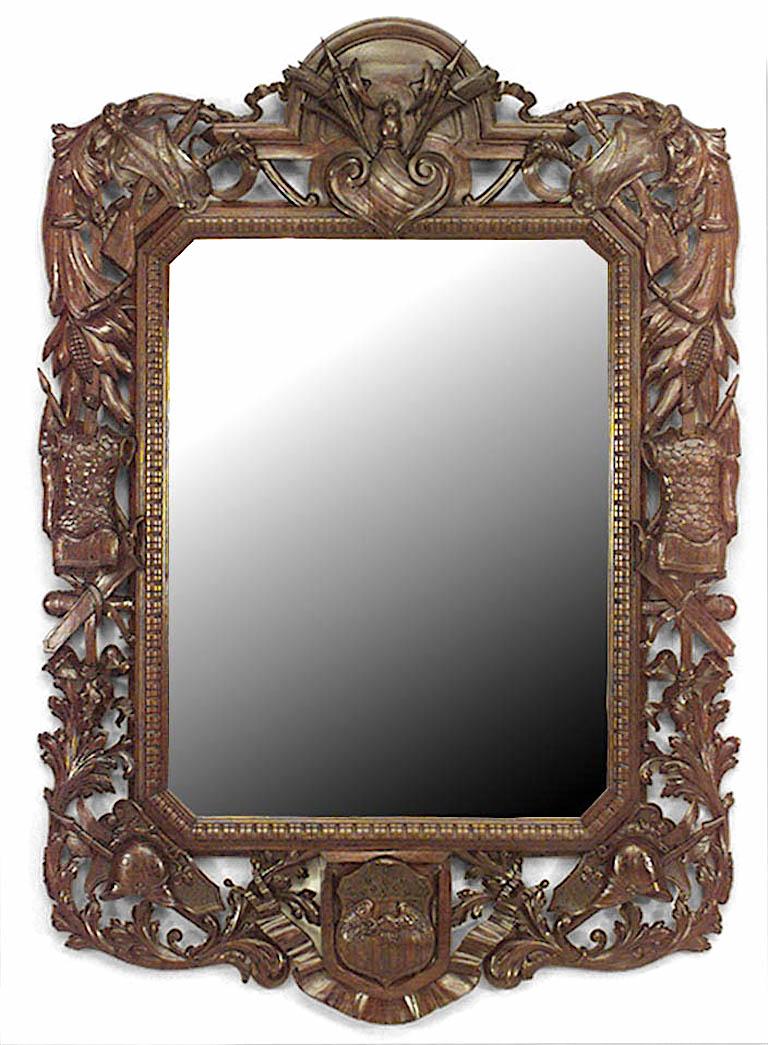 American Victorian vertical filigree carved mahogany wall mirror with military motifs and an American crest at the base.
