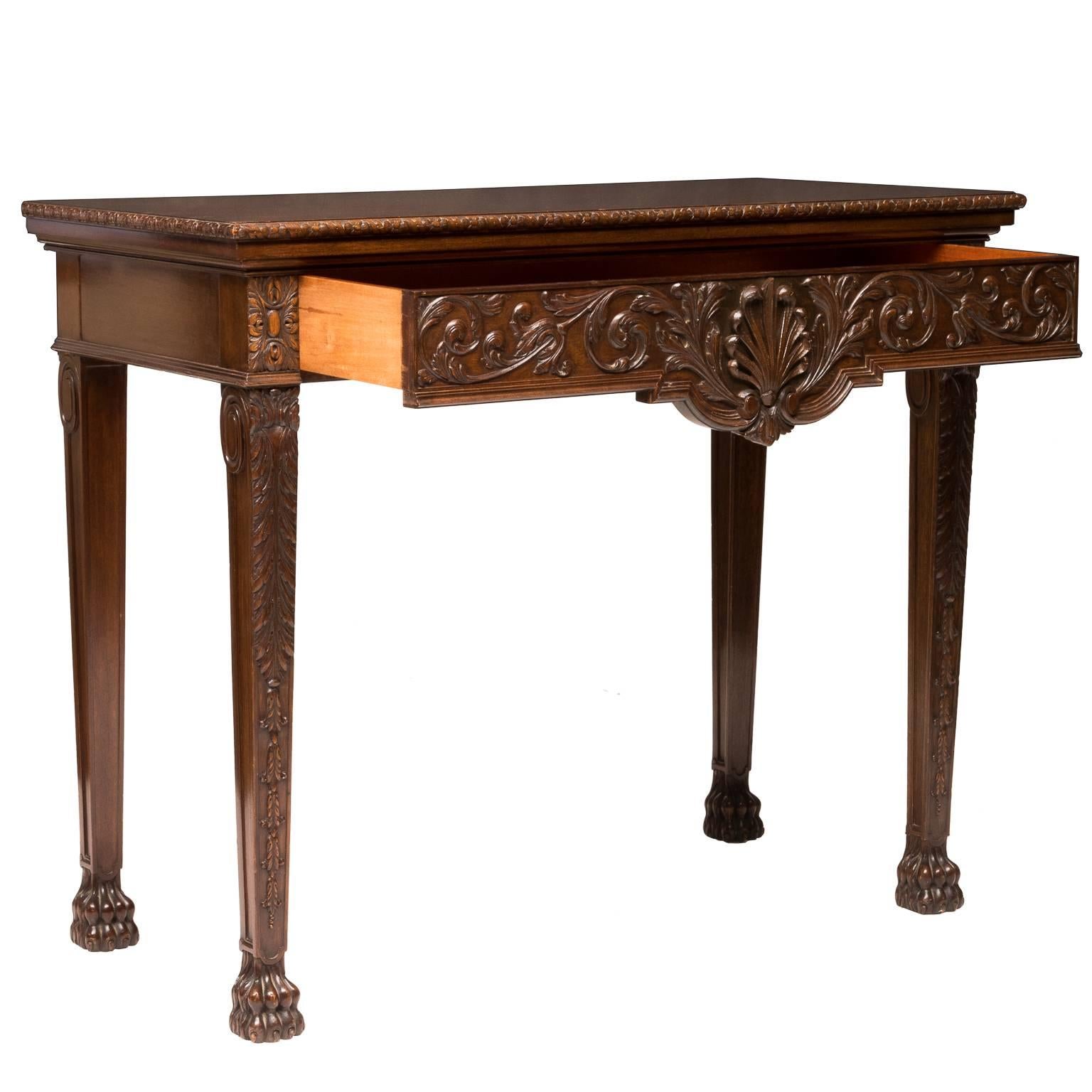 A 19th century William & Kent style console made from mahogany wood. Very detailed carvings, shells, leaf and vine, acanthus leaf, bell flowers and fine detailed claw feet. There is a single large drawer (dovetailed). Beautiful ribbon cut figured