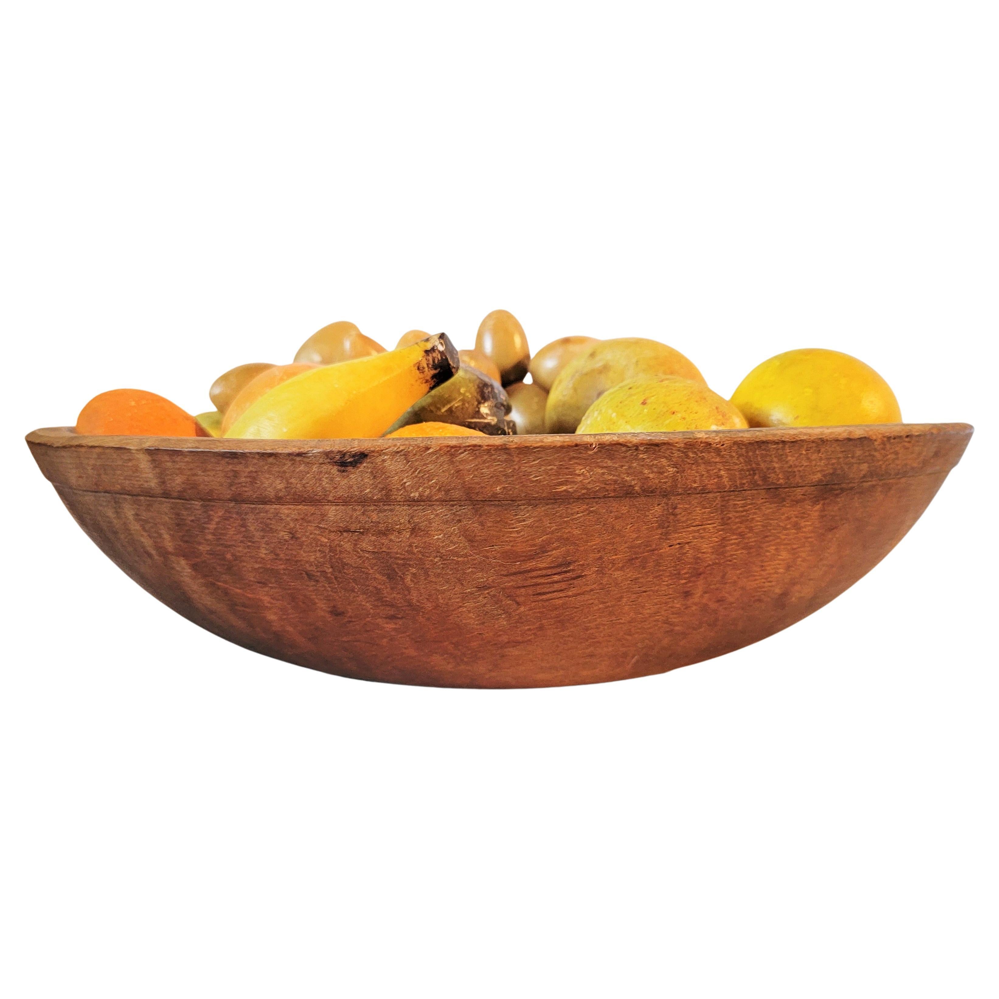19th C Wood bowl filled with an amazing collection of stone fruit from Italy. There are many different varieties of stone fruit. Selling as a complete collection.

Measurements are approximate. 
14wide x 15deep x 4.25 high.