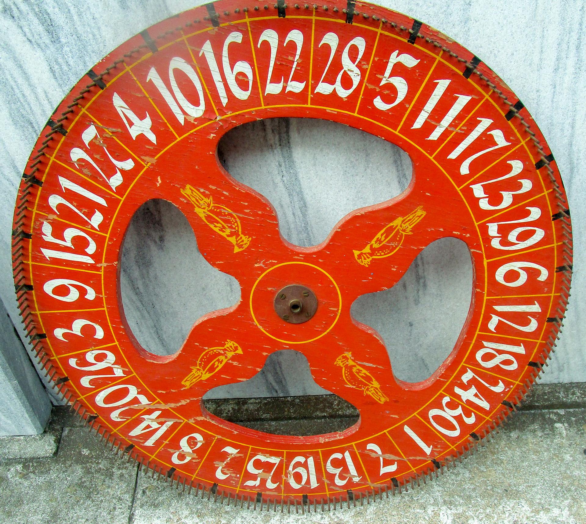 Metal 19thc Wooden Folk Art Gaming Wheel with Original Red Paint & Cardinal Design For Sale