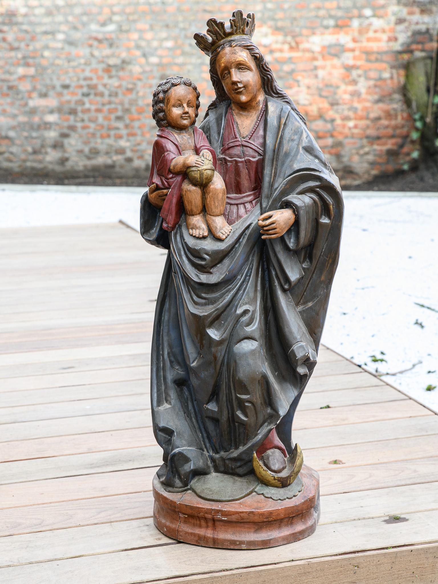 19th century wooden Statue of the virgin carrying Jezus.