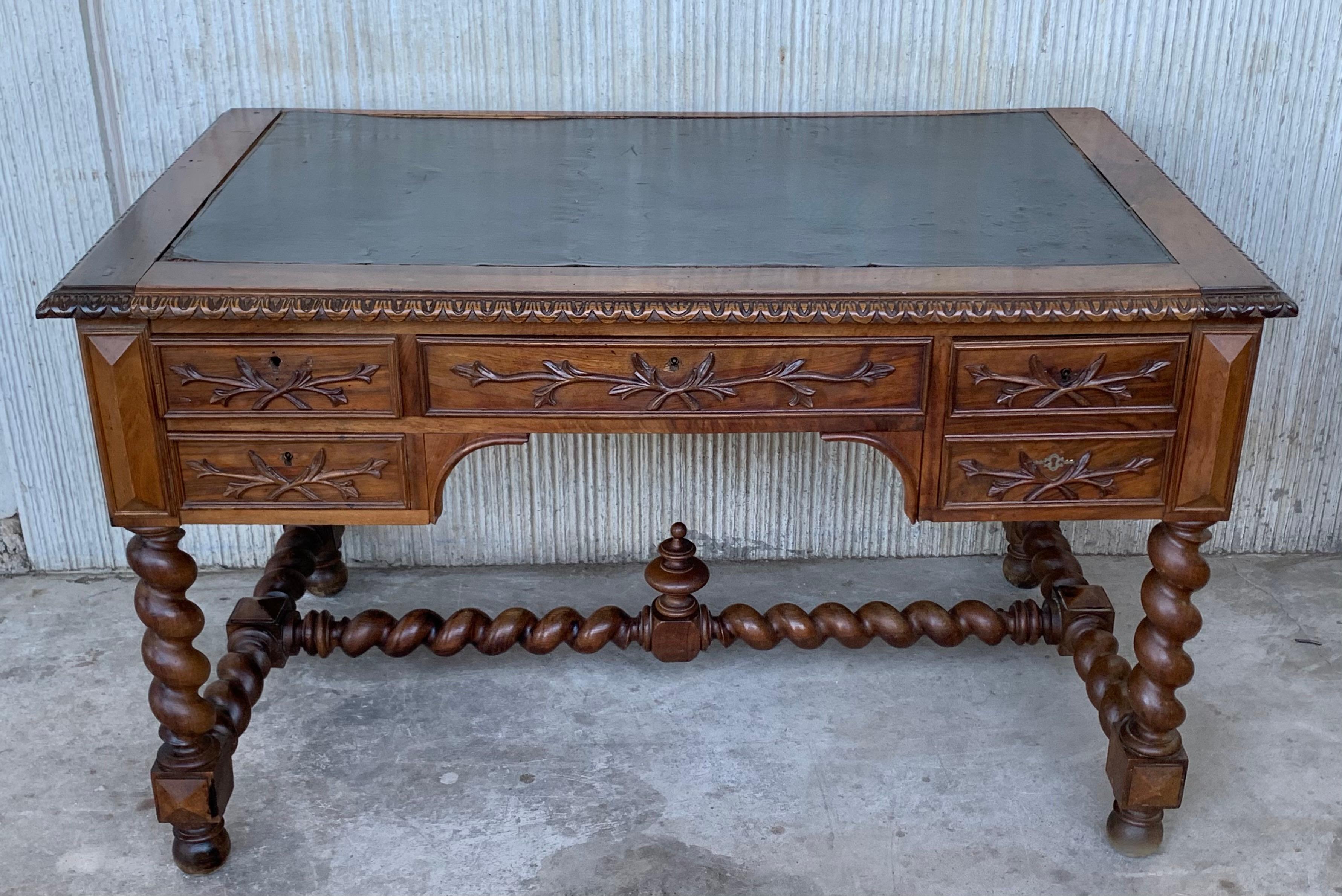 From France, circa 1860, this ornate, stripped oak desk has been carved in the Renaissance style and inset with a leather top. The H-shaped stretcher has a repeating Solomonic motif. . As the Renaissance advanced from the Early to the High