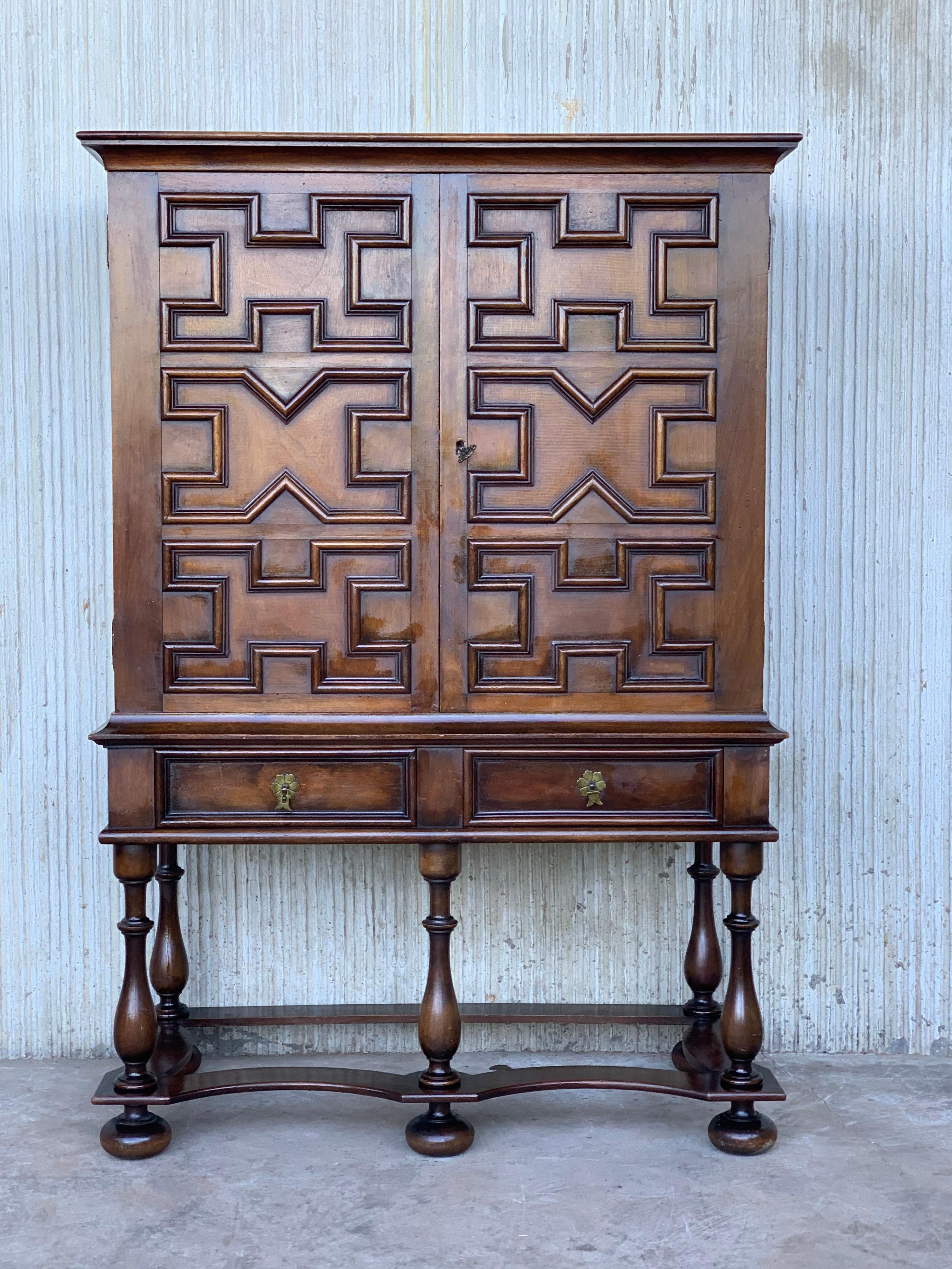 19th Catalan Spanish cabinet on stand in carved walnut  with two doors in the cabinet and two drawers in the low part.
The piece was made in one piece.
Very heavy and resistant, ready for use.
  
