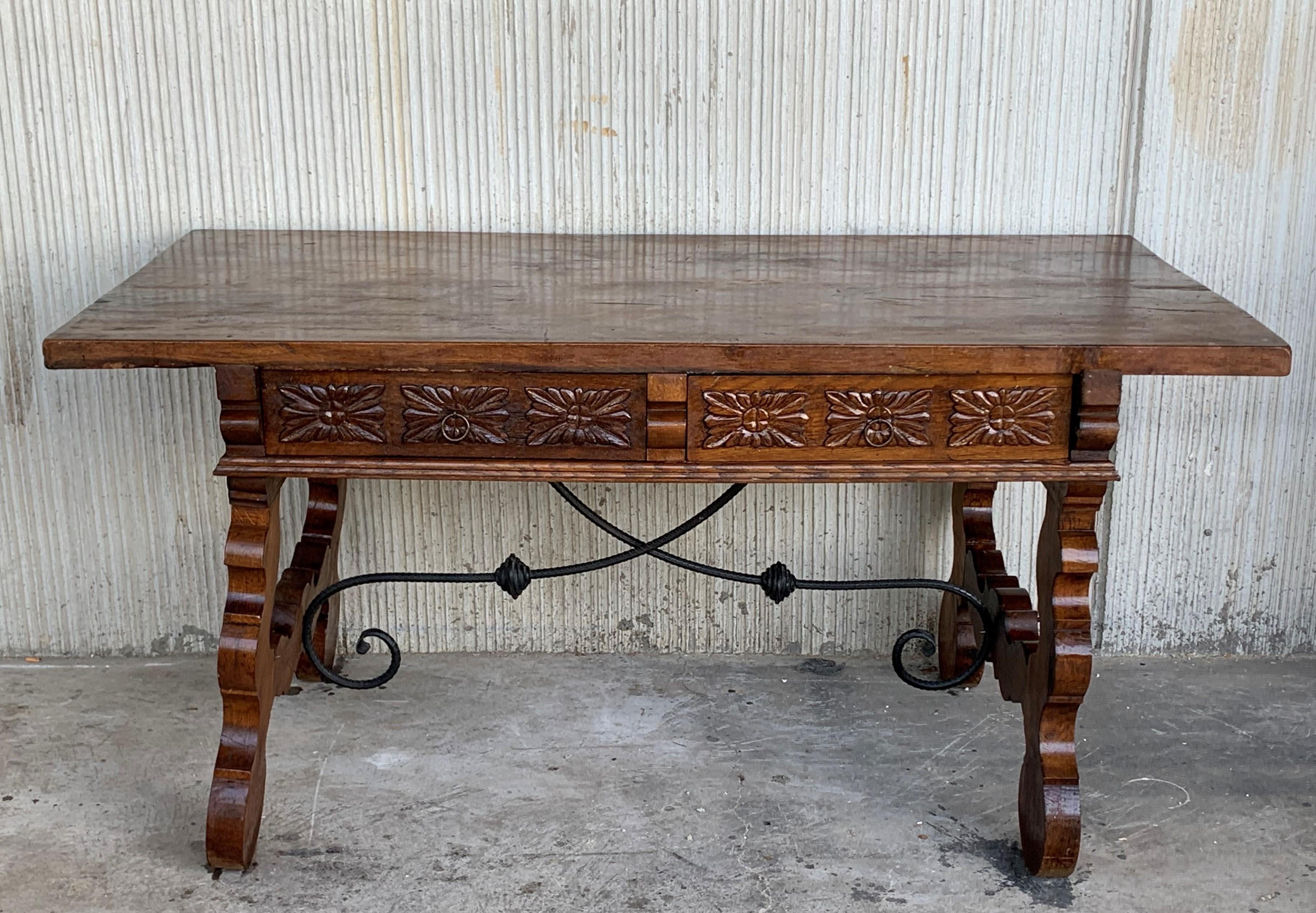 19th century Catalan Spanish desk or console table in carved walnut & iron stretcher with two large drawers and the same carved in the back of the desk.
Very heavy and resistant, ready for use.

Measures: Height to the top 29.92in
Height to the
