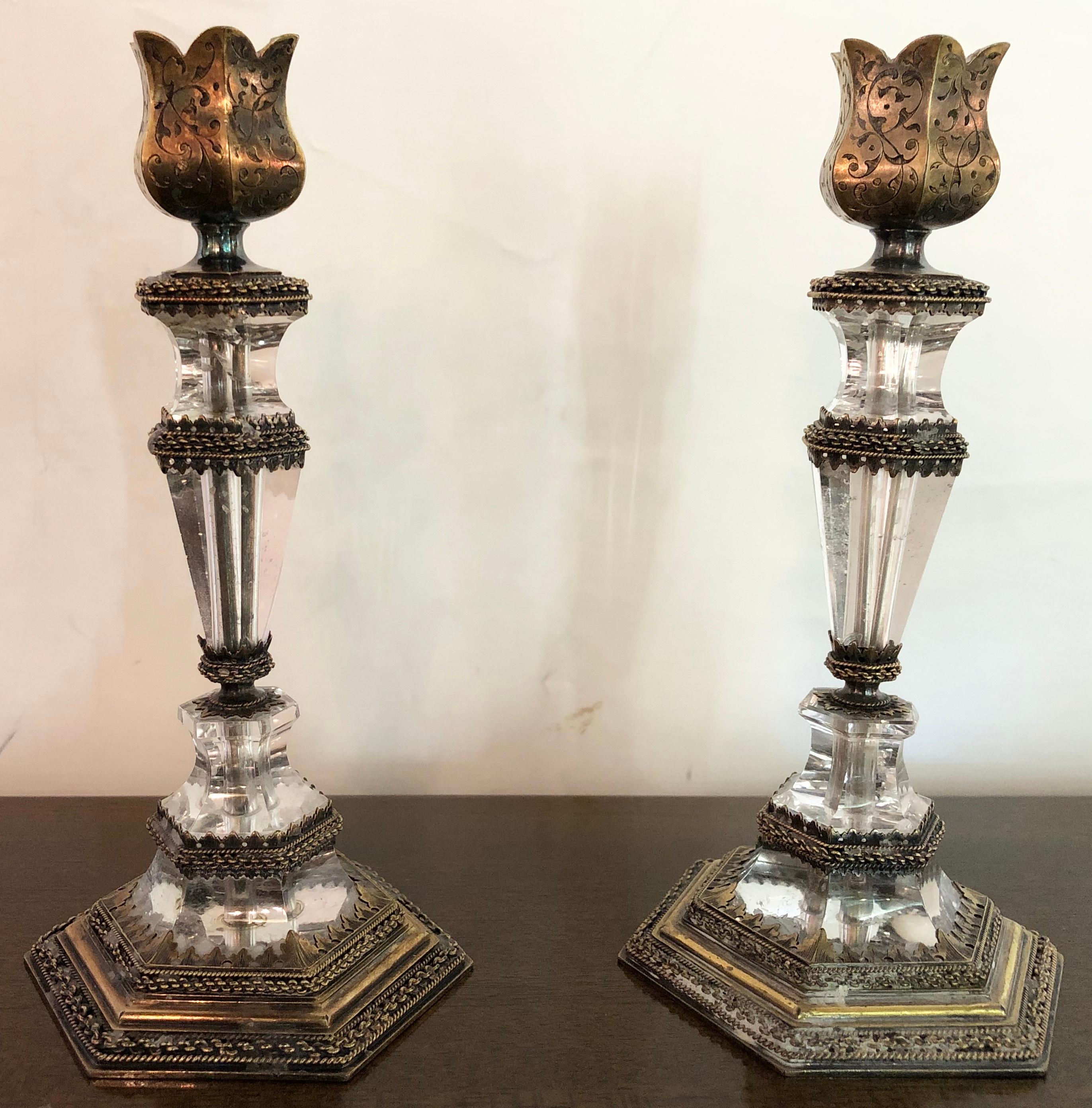 19th century exquisite Austrian rock crystal gilt silver candlesticks. The pair having hexagonal bases. This finely cast pair of candlesticks come direct from a Greenwich Ct mansion and are quite arguably the finest pair on the market. The hand