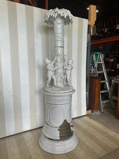 19th cent continental faience stove with palm tree and cherubs, likely Swedish