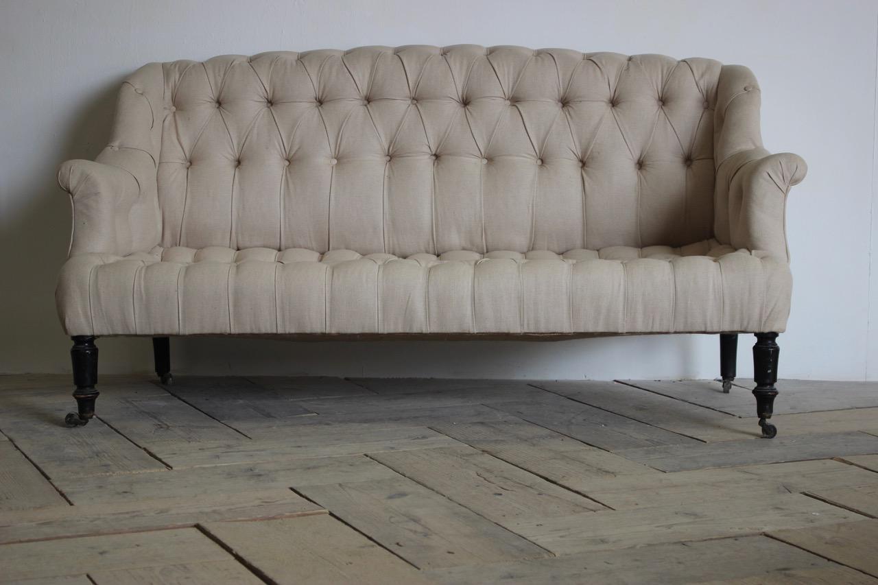 A 19th century French Napoleon III upholstered button sofa of small proportions, ideal for a bedroom. 

France 

Measurements: 33cm high (floor to seat).