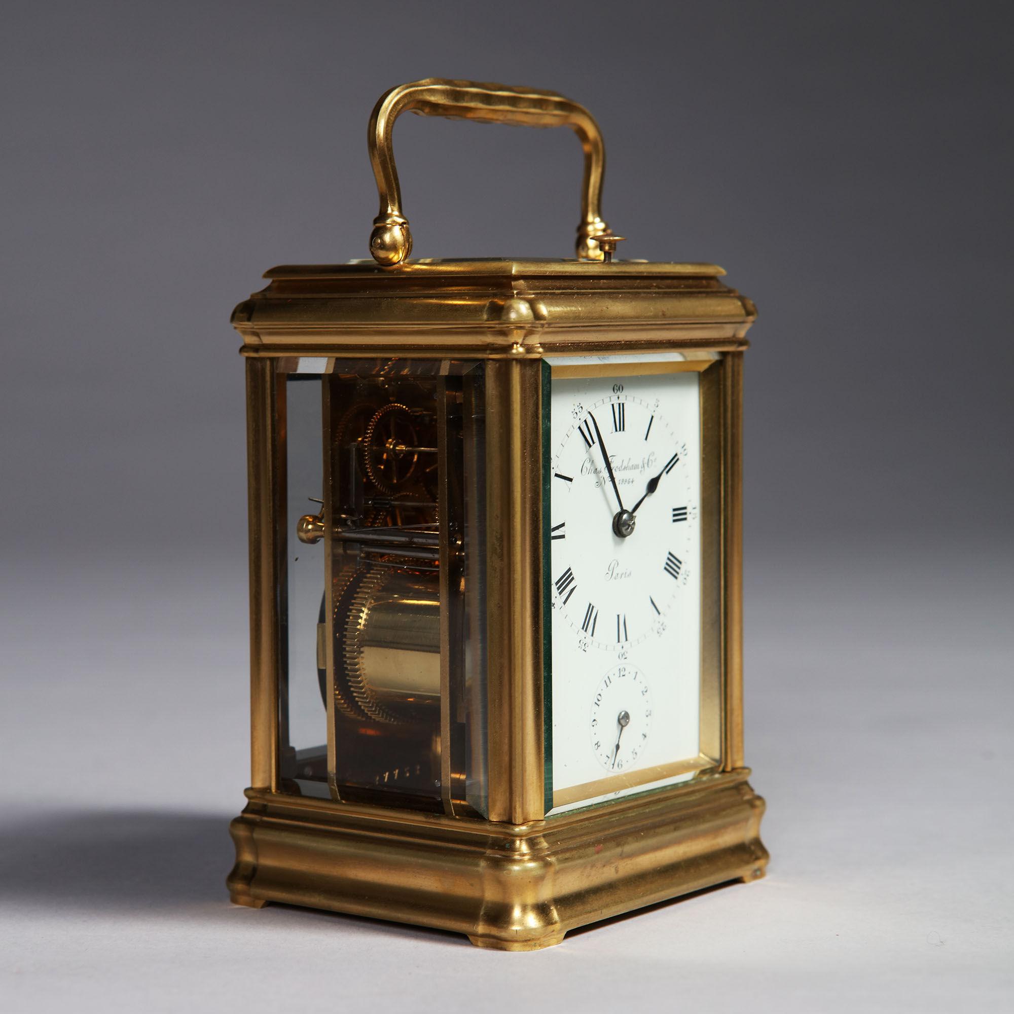 The so-called gorge case has its original gilding. It has bevelled glass panels on all sides so that the movement is entirely visible and is surmounted by a shaped carrying handle. The white enamel dial has a Roman chapter ring, with Arabic