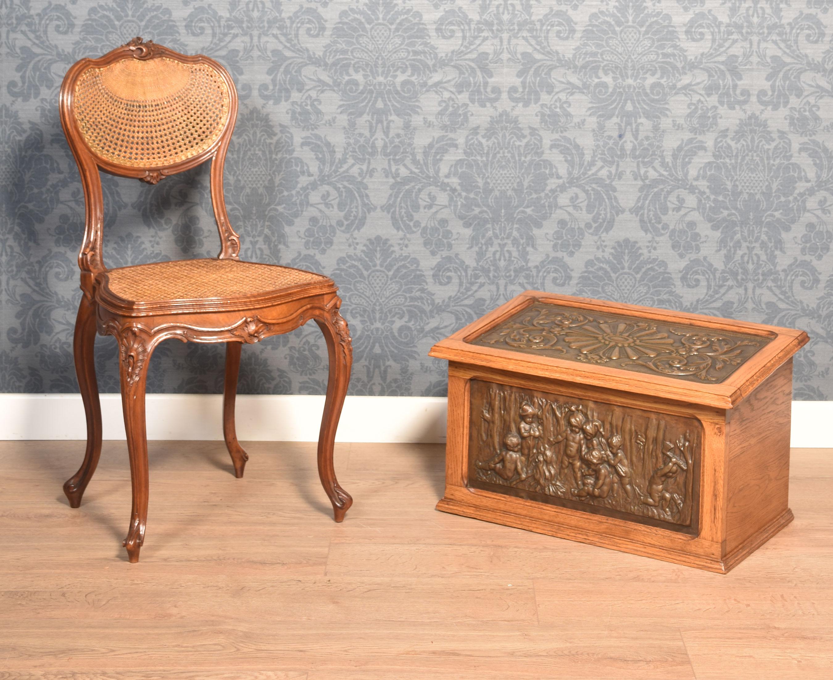 19th-century oak slipper box having embossed copper panels opening to reveal a large storage compartment.
Dimensions
Height 14.5 Inches
Width 24 Inches
Depth 15.5 Inches