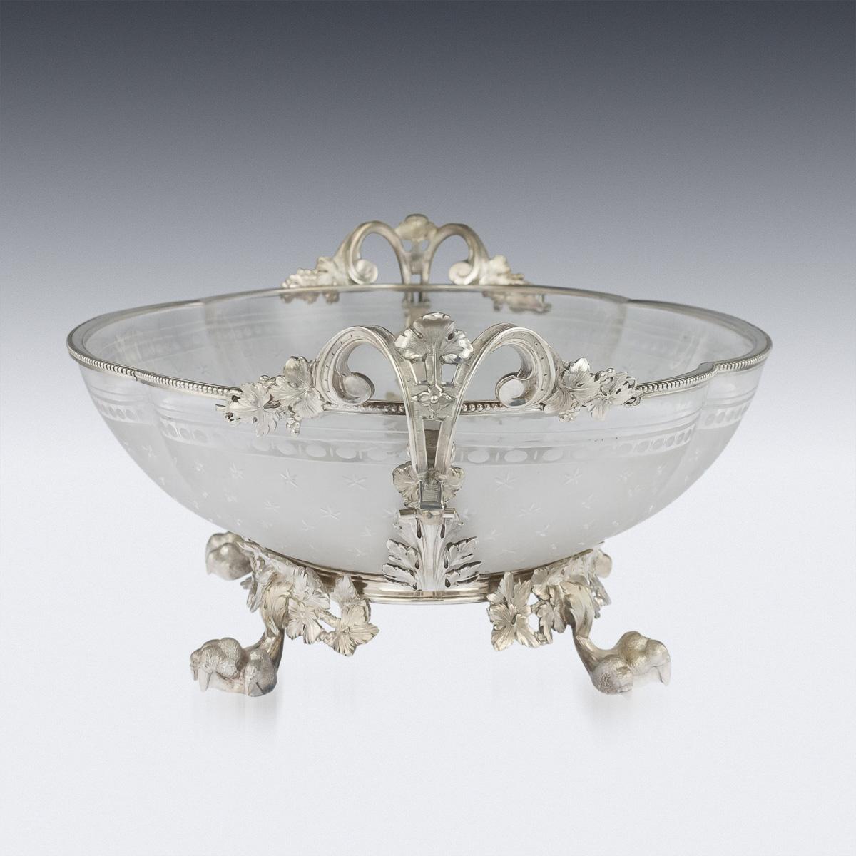 Antique 19th century French Empire style solid silver large centerpiece bowl. The oval etched glass, mounted with a beaded silver rim and decorated with scroll and floral handles, applied with acanthus and wine leaves, standing on four eagle claw