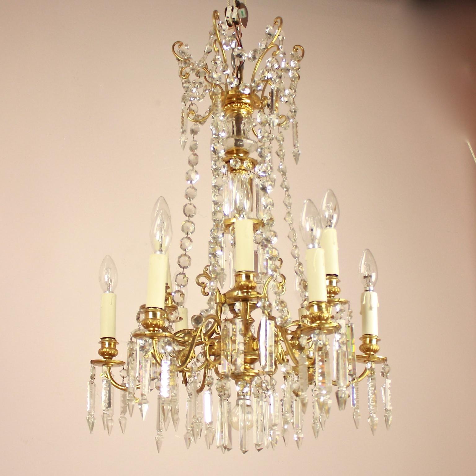 19th Century French Louis XVI Style 12-Light Gilt Bronze Cut Crystal Chandelier 

A converted 12-light gas chandelier, made in France in the 2nd half of the 19th century, also called 'gaselier' featuring gilt bronze scrolling arms on two levels and