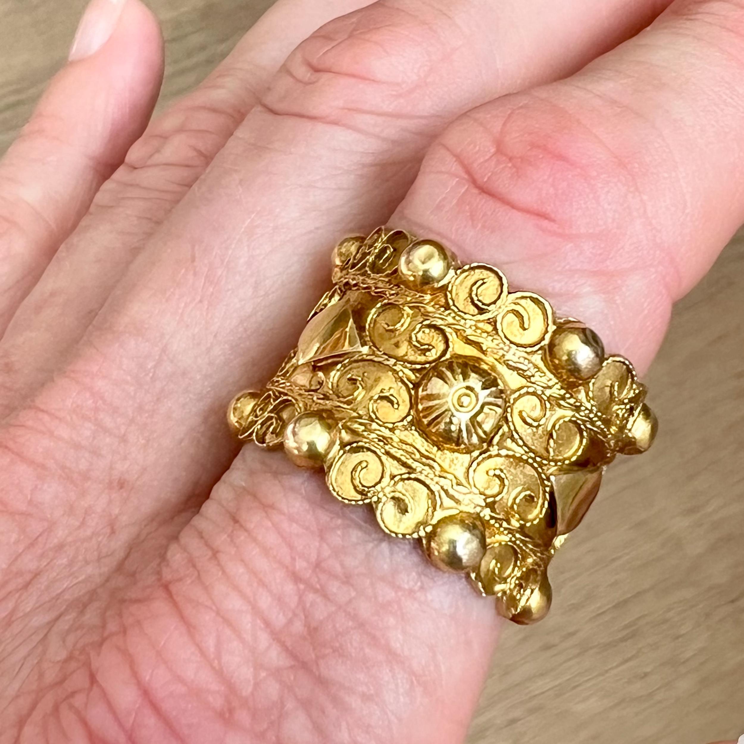 A 19th Century band ring designed with diamond-shaped figures and a religious cross. The 14 karat gold ring dates from around 1900. The ring, with religious symbol, was used exclusively in the four Roman Catholic villages in South Beveland, Zeeland.