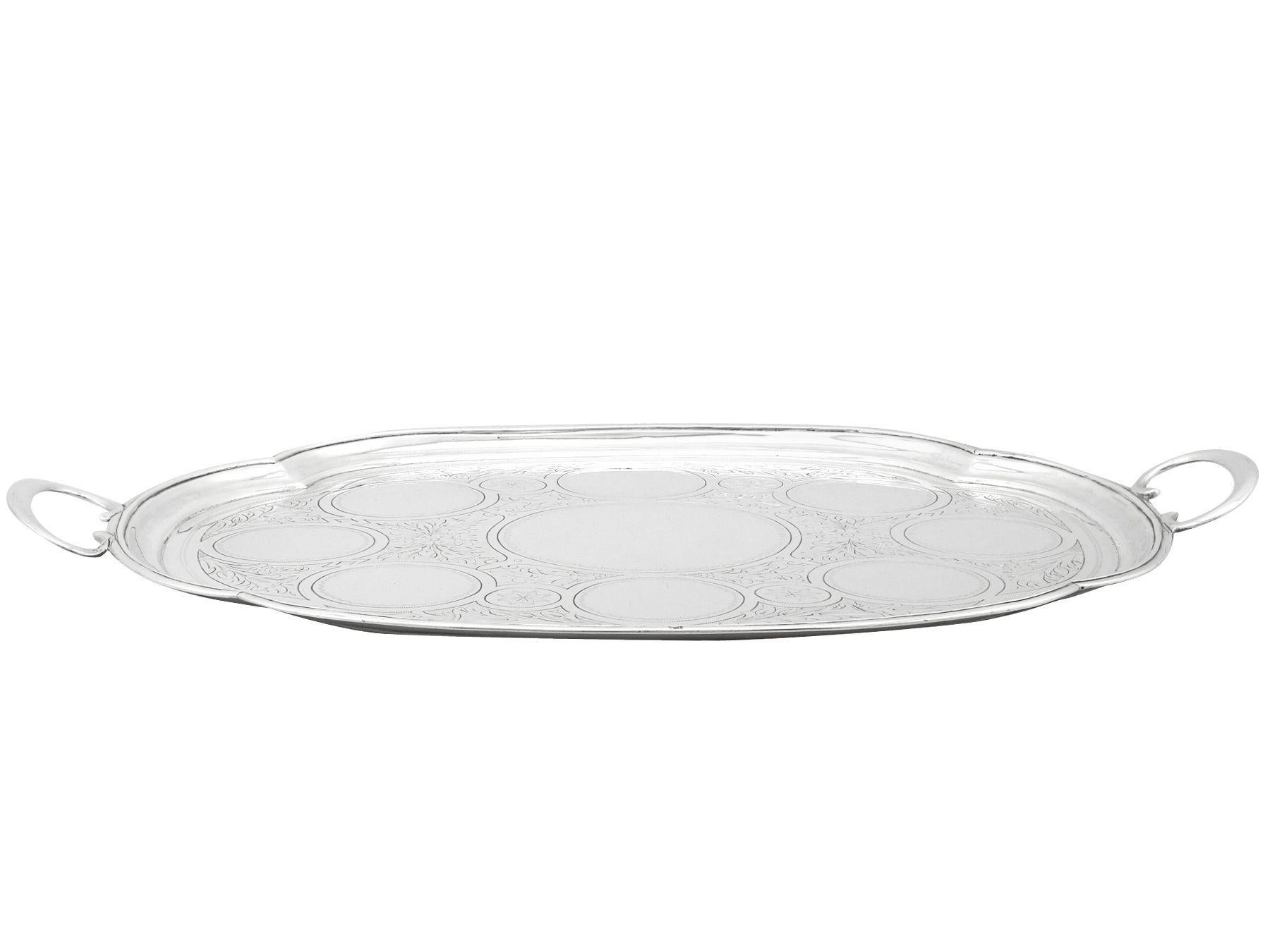An exceptional, fine and impressive antique Russian silver drinks tray; an addition to our ornamental Russian silverware collection.

This fine antique Russian silver tray has an oval shaped form.

The surface of the drinks tray is embellished with