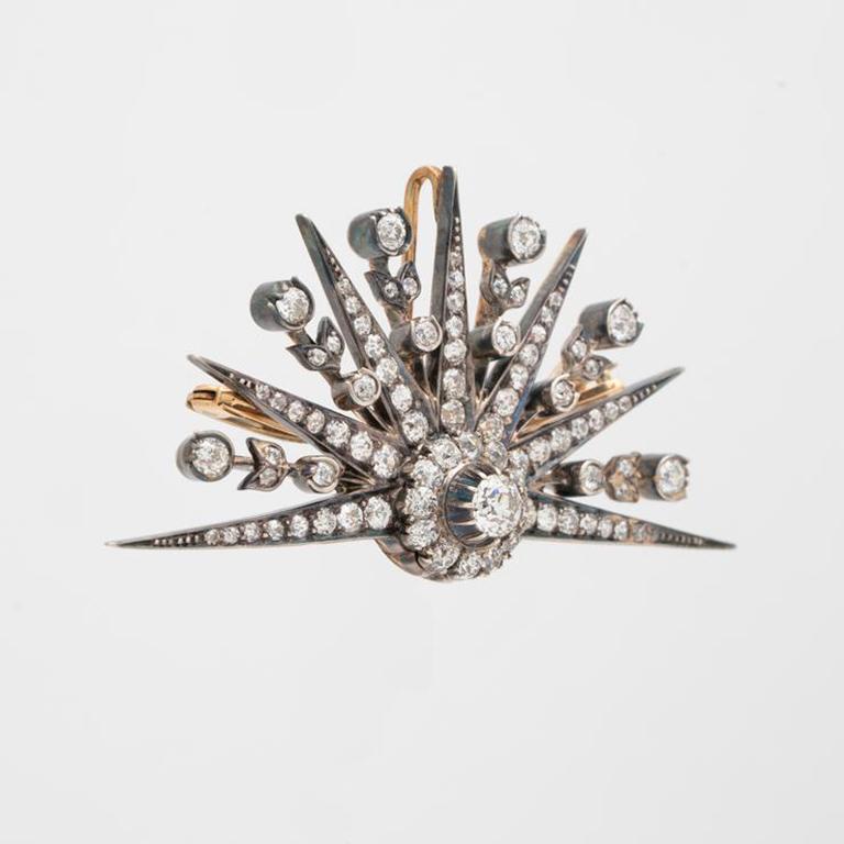 19th Century 18k yellow gold, silver 5.0cts diamond demi-starburst brooch .c 1870s

Additional Information:
Period: 19th Century, Victorian
Year: c.1870s
Material: 18K Yellow Gold, Silver and Diamonds
Weight: 16.89g
Height: 34.11mm/1.34 inches