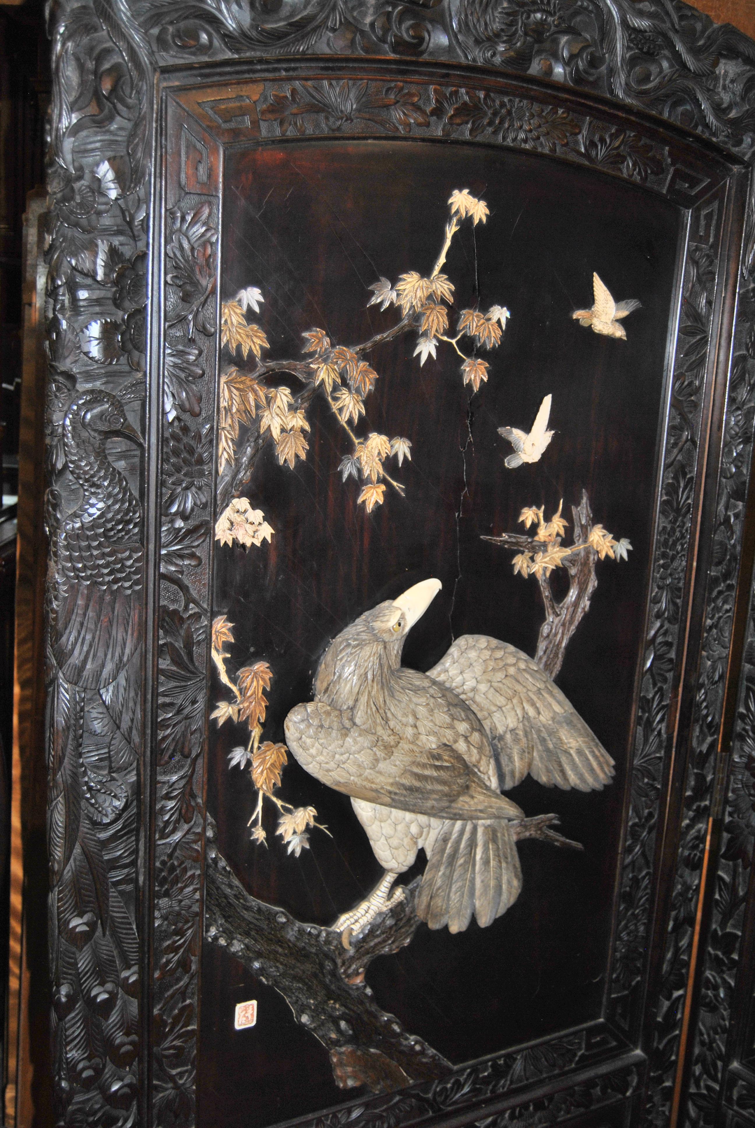 This is a 2 Panel Dressing Screen / Room Divider made in China, circa 1880. The frame of the screen is made of Solid Mahogany and has some of the most beautiful, finest quality, deep hand carvings imaginable. Each panel is black lacquered with hand