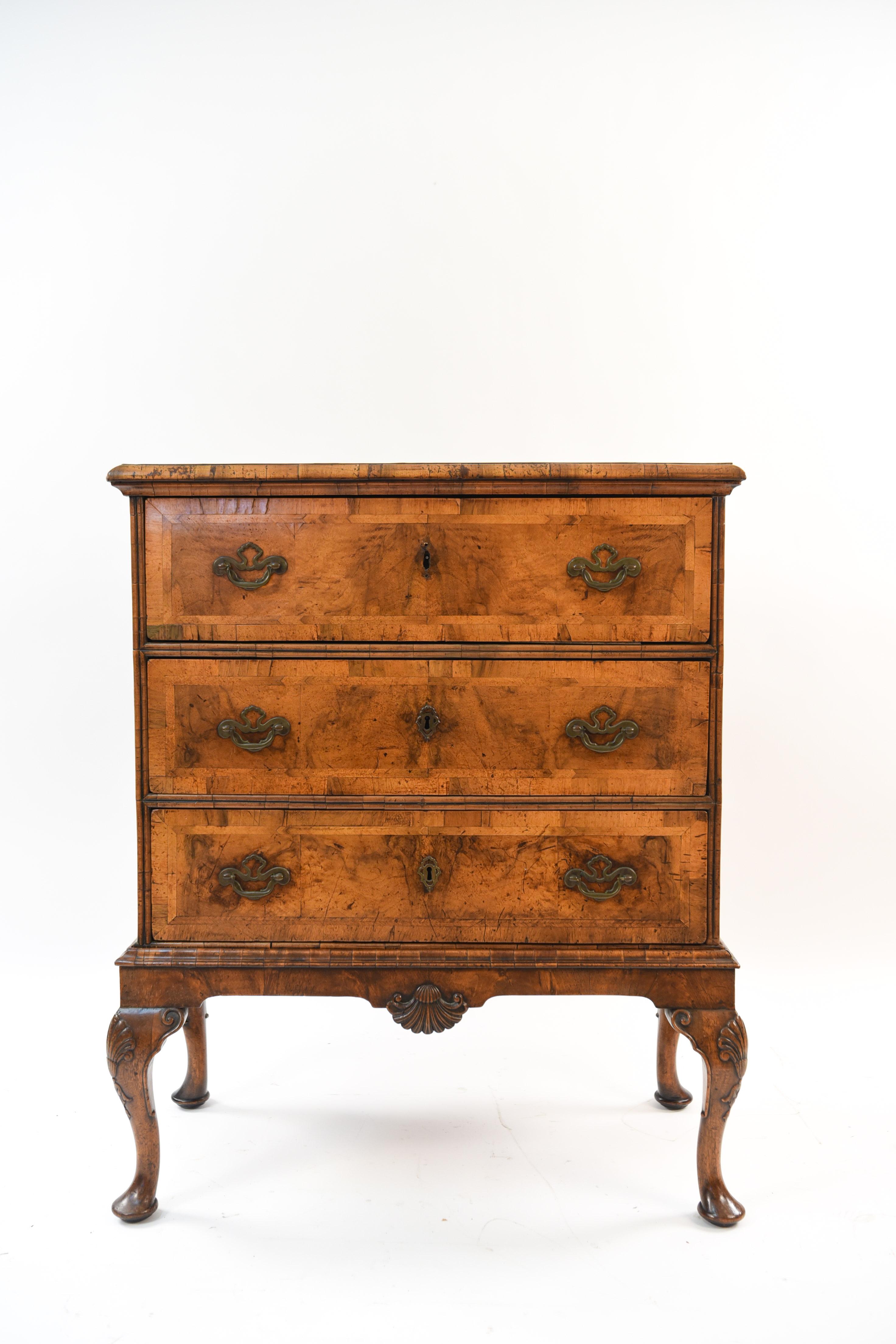 This petite 19th century three-drawer chest sits upon a base with legs and separates for convenient transportation. With key that works on top two drawers. This piece would do well in a small interior, such as an apartment, to conserve space due to