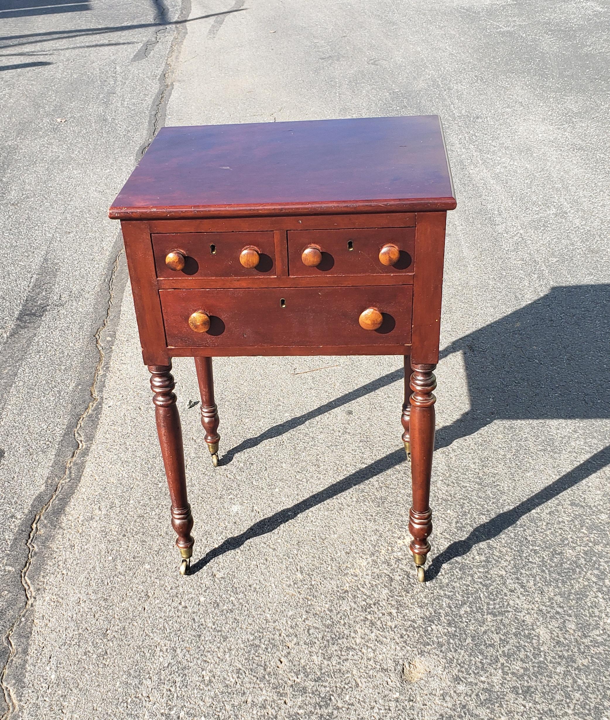 19th Century 3-drawer turned legs mahogany work table on wheels.
Features two smaller top drawers measuring 6.75