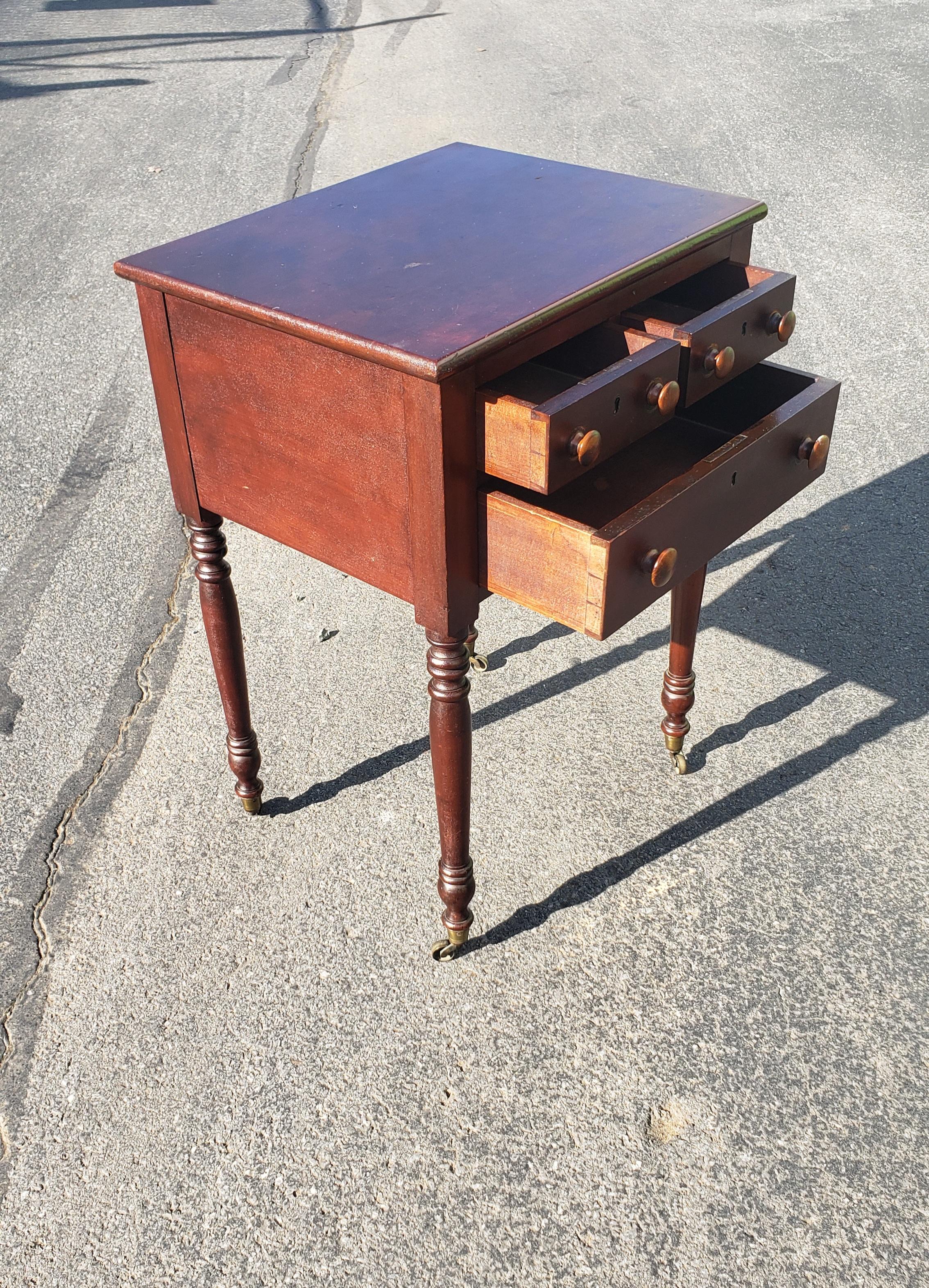 Woodwork 19th Century 3-Drawer Turned Legs Mahogany Work Table on Wheels For Sale