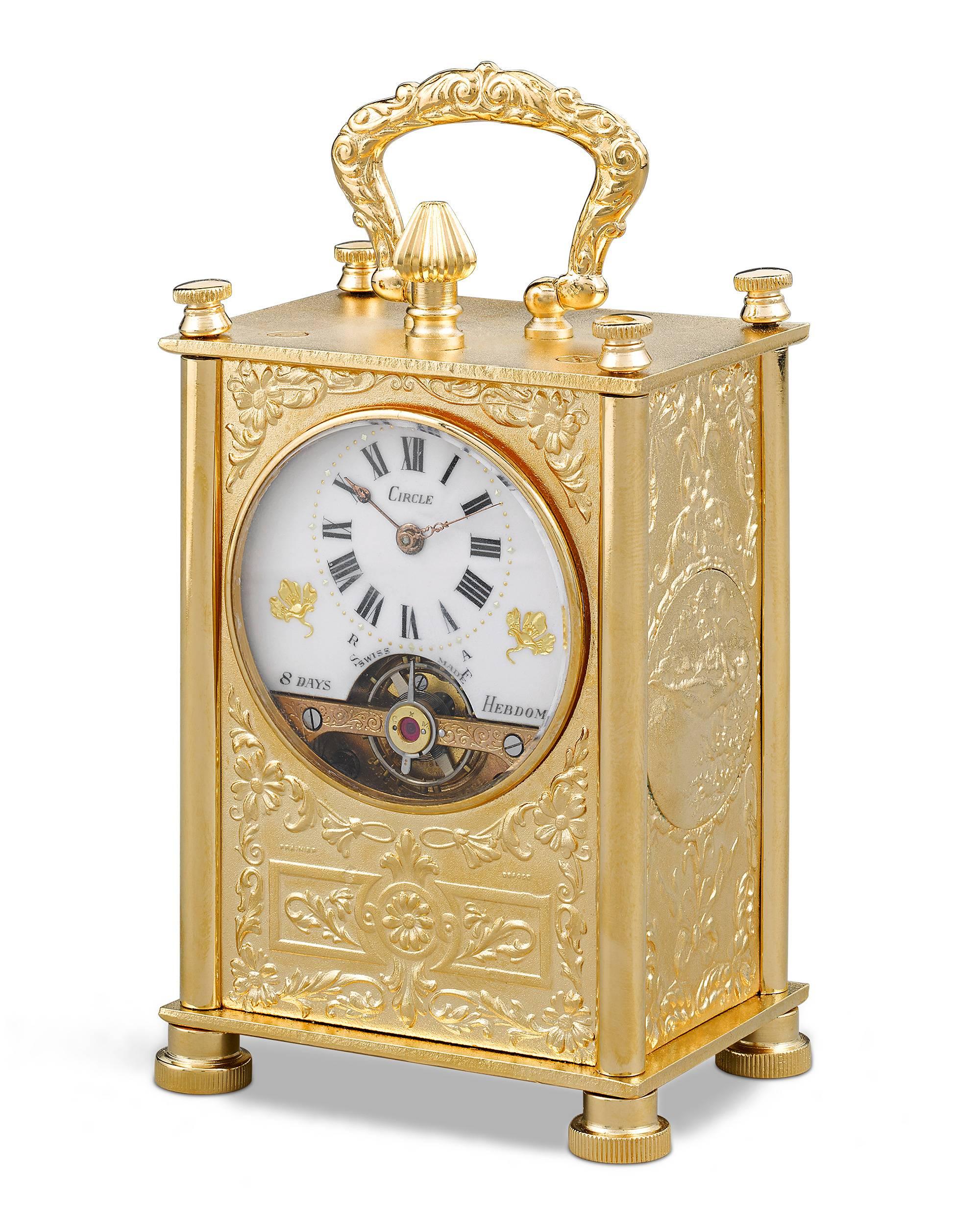 This charming 8-day Swiss carriage clock is crafted of gilt bronze in an elegant Neoclassical style. These incredibly complex clock mechanisms were well suited for travel, for they operate without a pendulum. During the second half of the 19th