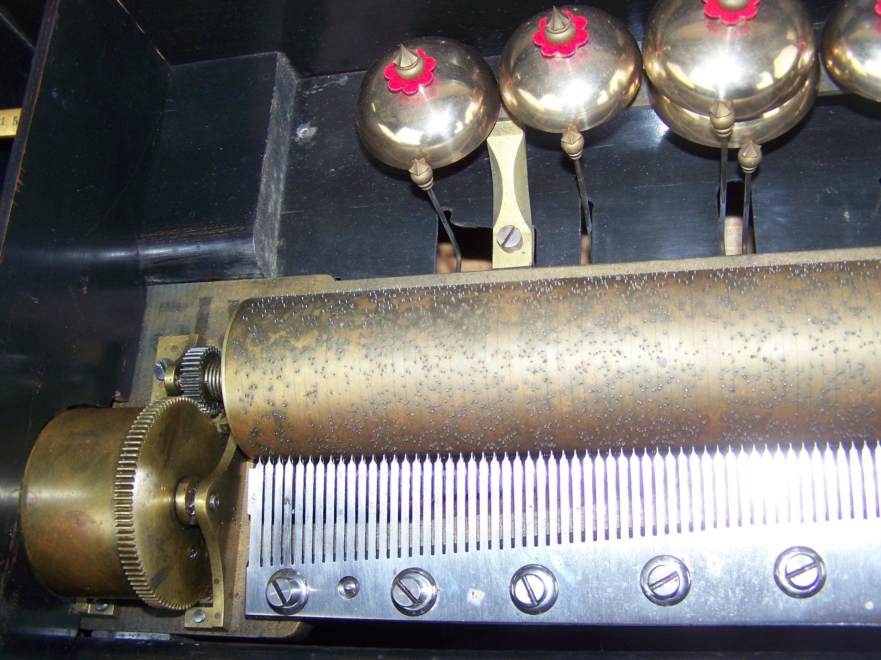 Bronze 19th century 8 tune music box with 6 bells