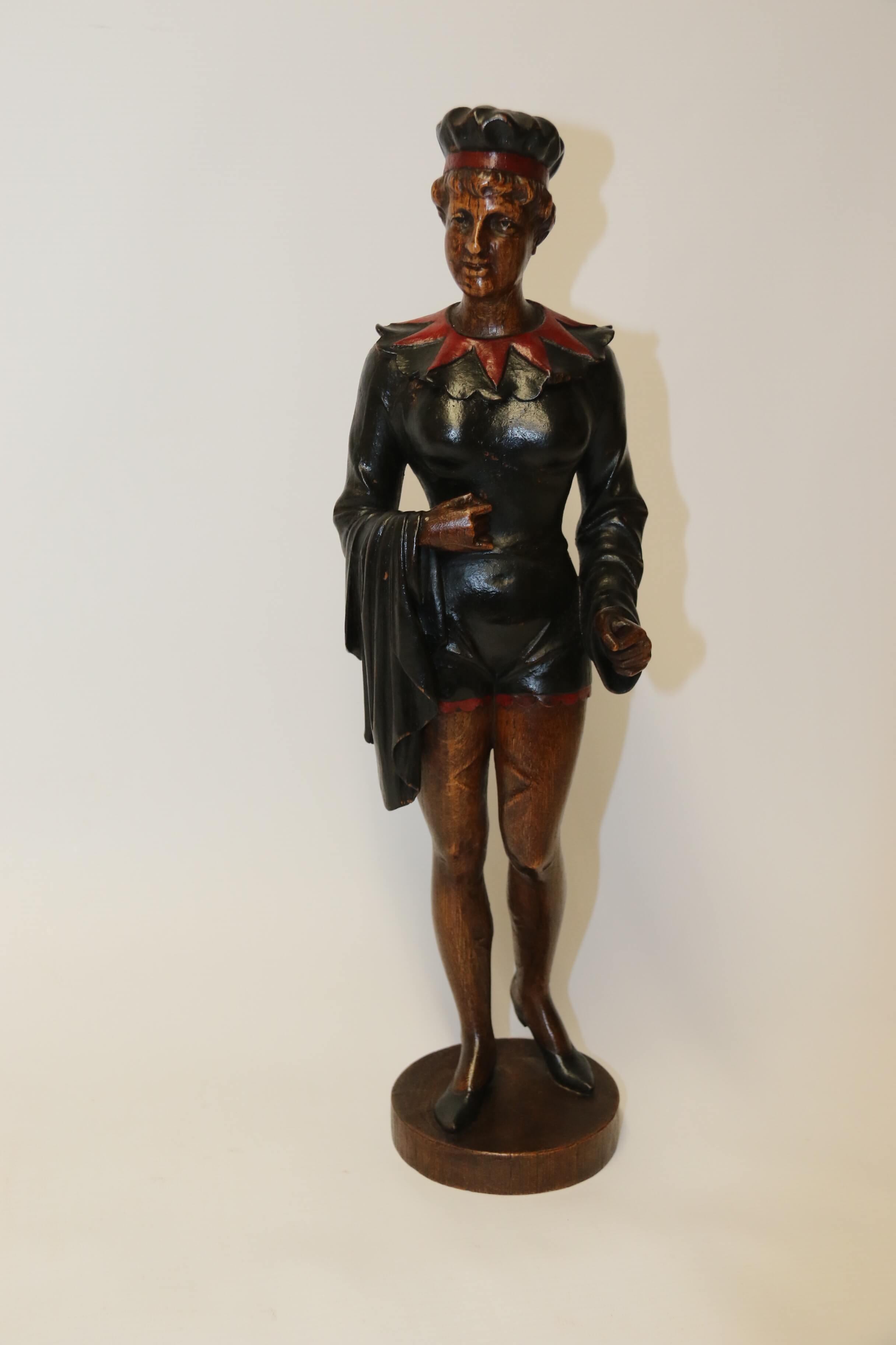 Carved in English oak this rather unusual and quirky figure depicts a Victorian actress dressed in theatre costume.
She has polychrome decoration in black and red.
The carver has inscribed his initials CVR and the date 1893 are on the reverse of